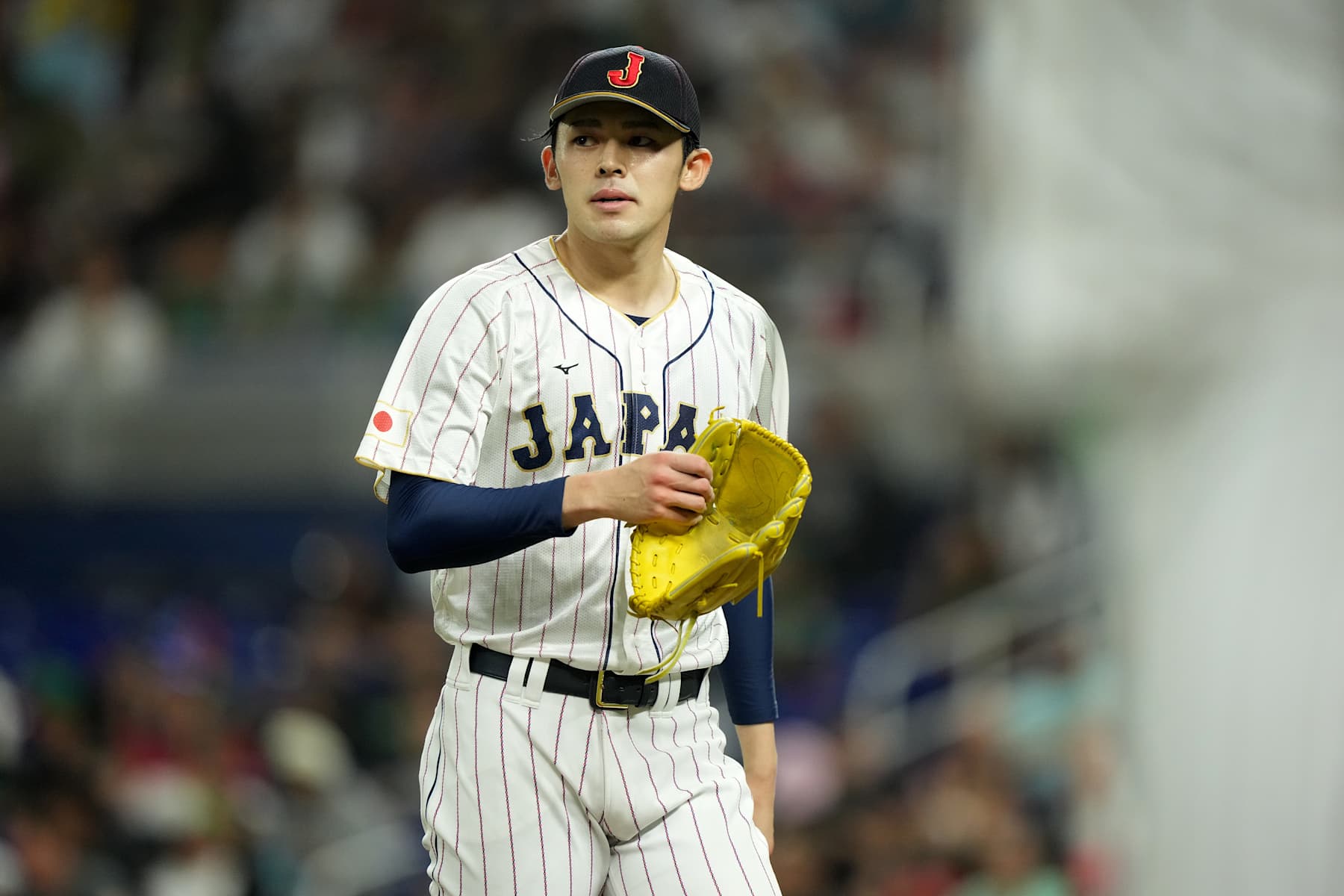 MIAMI, FLORIDA - MARCH 20: Roki Sasaki #14 of Team Japan walks off the mound at the end of the first inning against Team Me during the World Baseball Classic Semifinals at loanDepot park on March 20, 2023 in Miami, Florida. (Photo by Eric Espada/Getty Images)