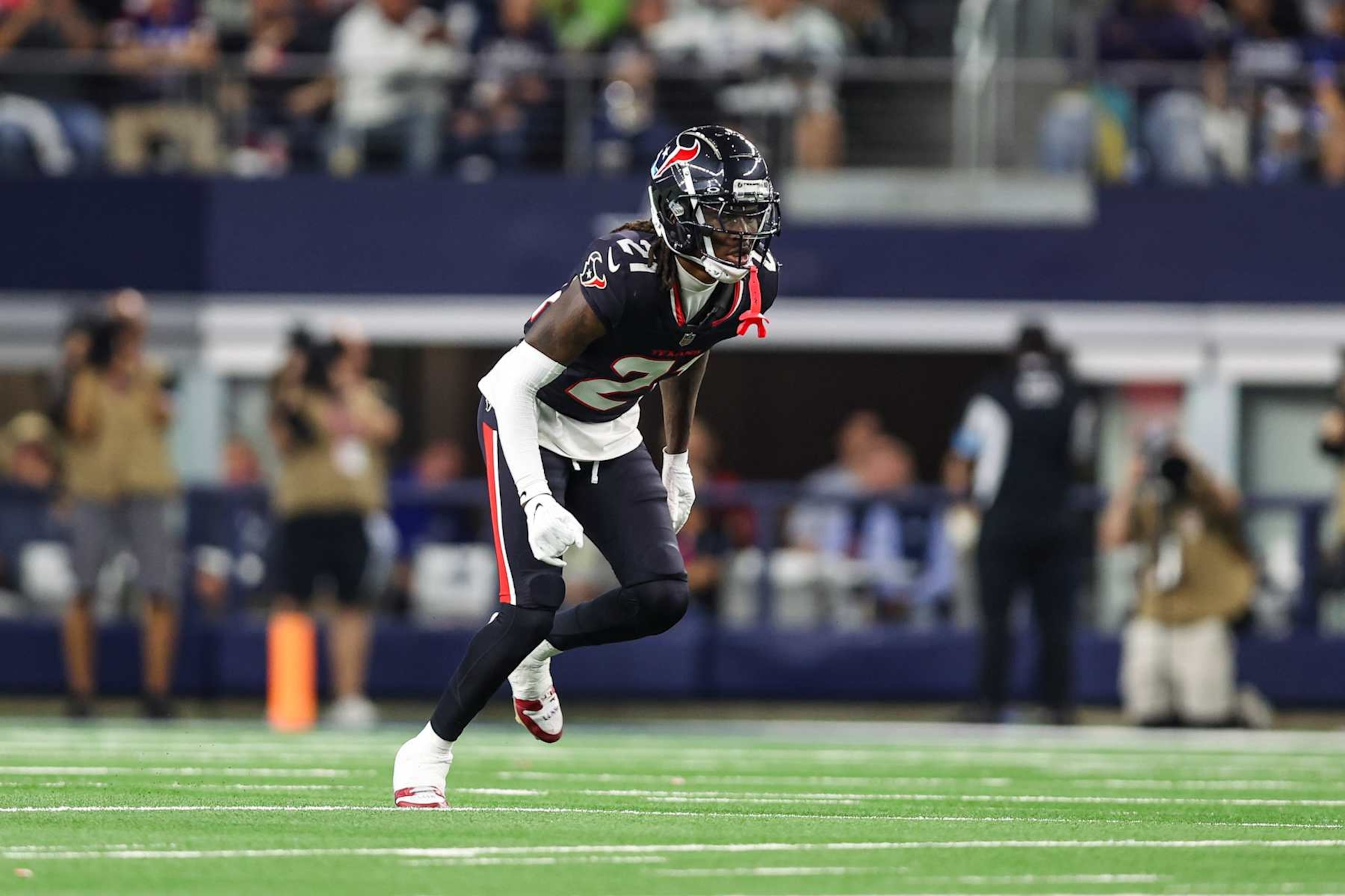 ARLINGTON, TEXAS - NOVEMBER 18: Calen Bullock #21 of the Houston Texans defends in coverage during an NFL football game against the Dallas Cowboys at AT&T Stadium on November 18, 2024 in Arlington, Texas. (Photo by Perry Knotts/Getty Images)