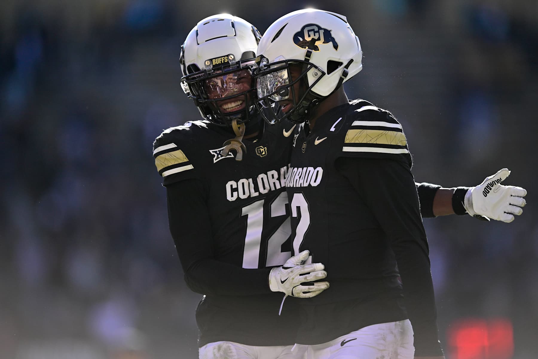 BOULDER, CO - NOVEMBER 29: Shedeur Sanders #2 and Travis Hunter #12 of the Colorado Buffaloes celebrate after a third quarter touchdown against the Oklahoma State Cowboys at Folsom Field on November 29, 2024 in Boulder, Colorado. (Photo by Dustin Bradford/Getty Images)
