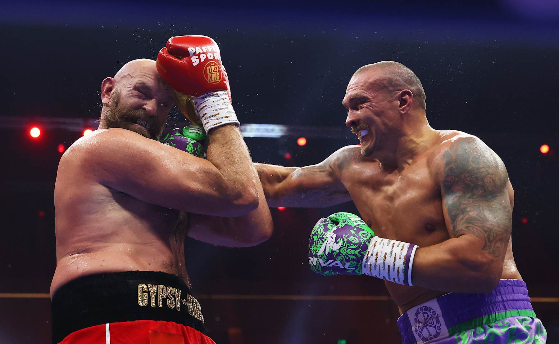 RIYADH, SAUDI ARABIA - DECEMBER 21: Oleksandr Usyk punches Tyson Fury during the IBF, IBO, WBA, WBC and WBO Undisputed World Heavyweight titles' fight between Oleksandr Usyk and Tyson Fury as part of Oleksandr Usyk v Tyson Fury 2, Reignited card at Kingdom Arena on December 21, 2024 in Riyadh, Saudi Arabia. (Photo by Richard Pelham/Getty Images)