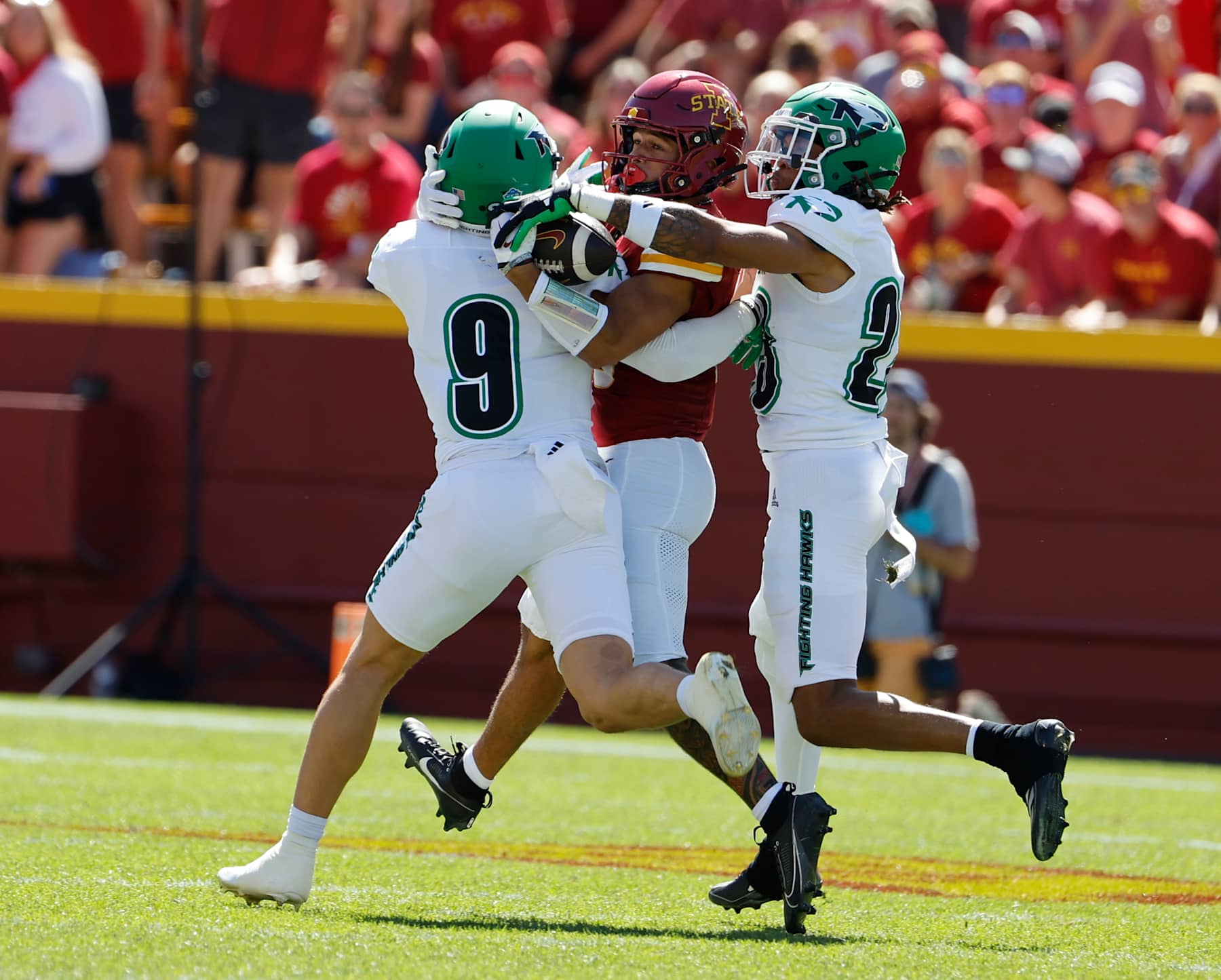AMES, IA - AUGUST 31: Wide receiver Jaylin Noel #13 of the Iowa State Cyclones pulls in a pass as defensive back Tyler Erkman #9, and defensive back Devin Hembry #23 of the North Dakota Fighting Hawks defend in the first half of play at Jack Trice Stadium on August 31, 2024, in Ames, Iowa. (Photo by David Purdy/Getty Images)