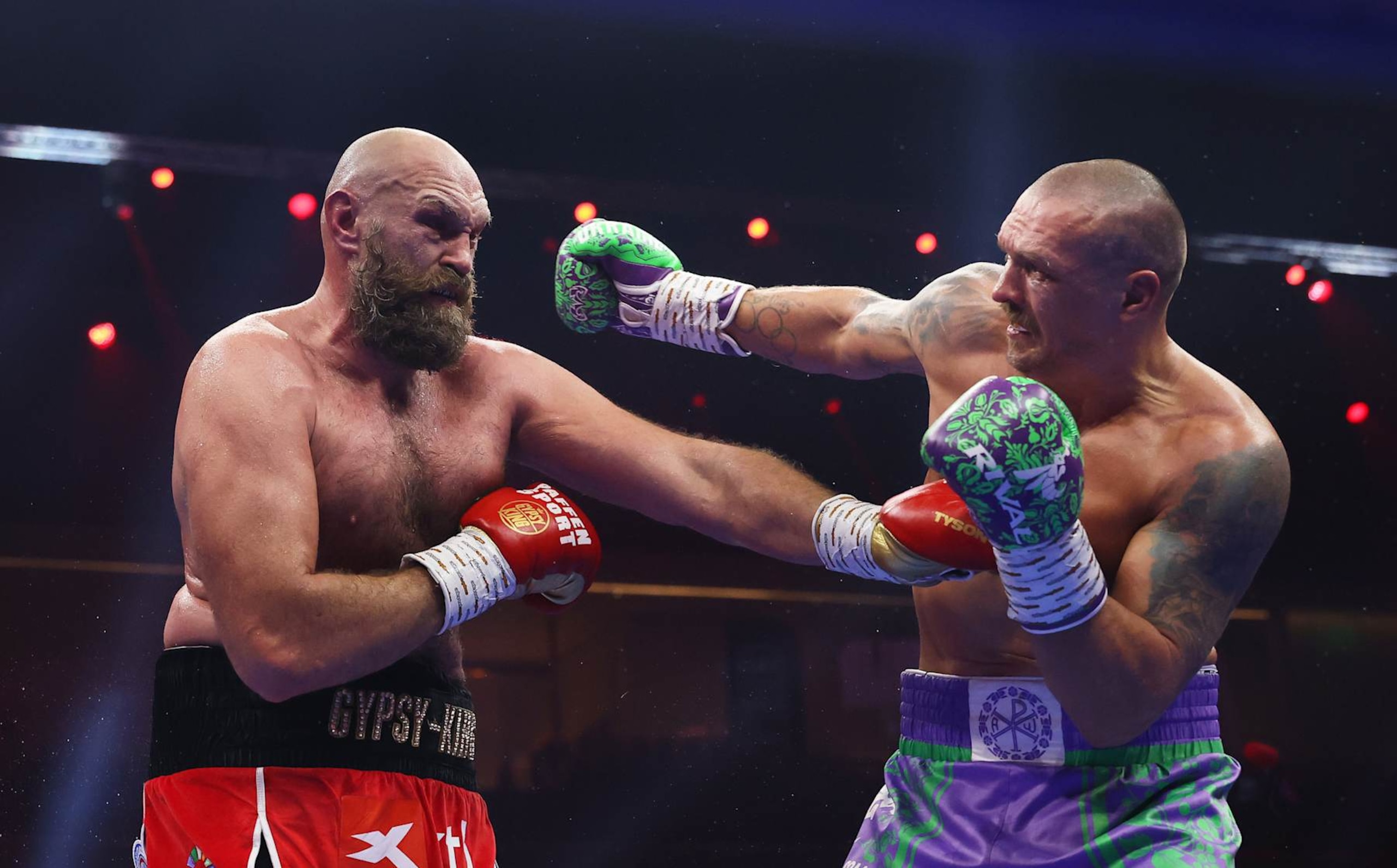 RIYADH, SAUDI ARABIA - DECEMBER 21: Oleksandr Usyk punches Tyson Fury during the IBF, IBO, WBA, WBC and WBO Undisputed World Heavyweight titles' fight between Oleksandr Usyk and Tyson Fury as part of Oleksandr Usyk v Tyson Fury 2, Reignited card at Kingdom Arena on December 21, 2024 in Riyadh, Saudi Arabia. (Photo by Richard Pelham/Getty Images)