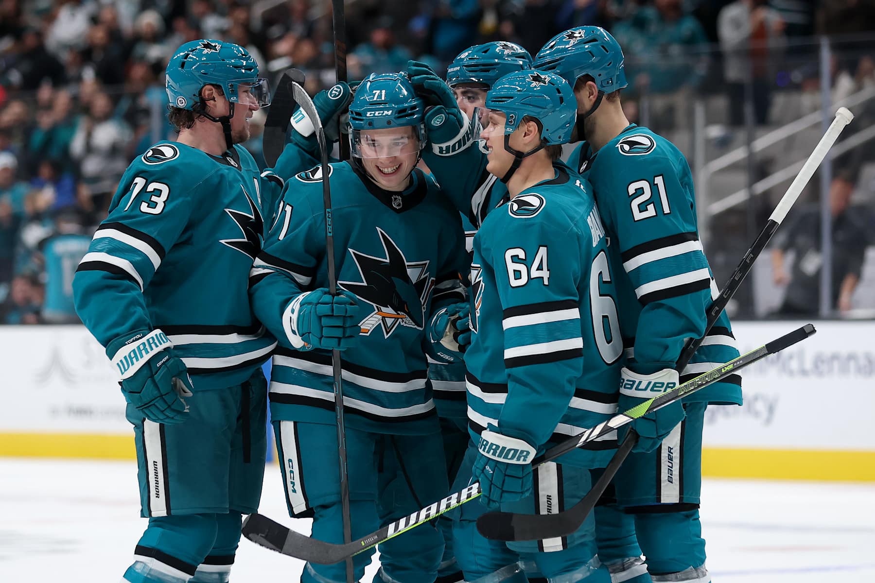 SAN JOSE, CALIFORNIA - DECEMBER 17: Macklin Celebrini #71 of the San Jose Sharks is congratulated by teammates after he scored against the Winnipeg Jets in the second period at SAP Center on December 17, 2024 in San Jose, California. (Photo by Ezra Shaw/Getty Images)