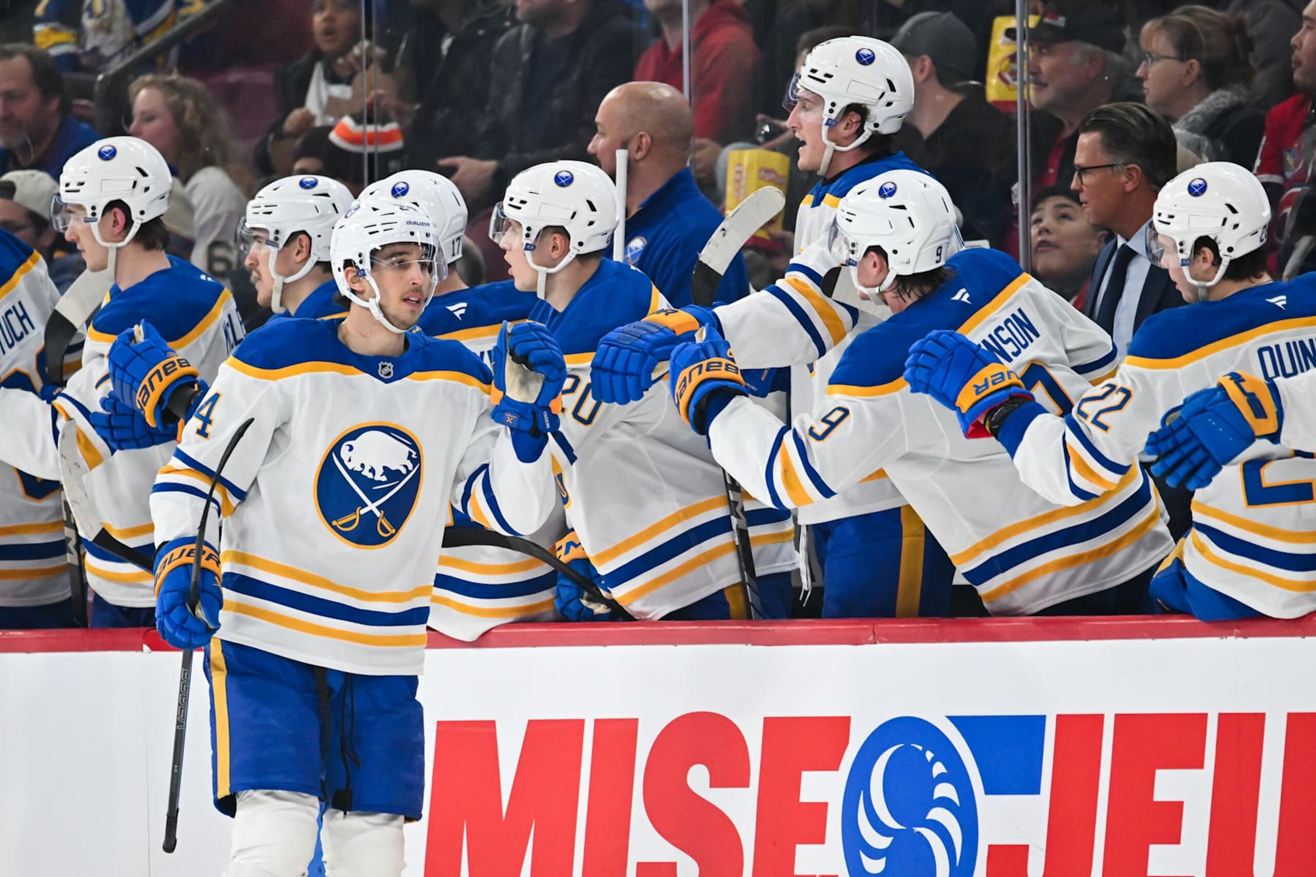 MONTREAL, CANADA - DECEMBER 17:  Dylan Cozens #24 of the Buffalo Sabres celebrates his goal with teammates on the bench during the second period against the Montreal Canadiens at the Bell Centre on December 17, 2024 in Montreal, Quebec, Canada.  (Photo by Minas Panagiotakis/Getty Images)