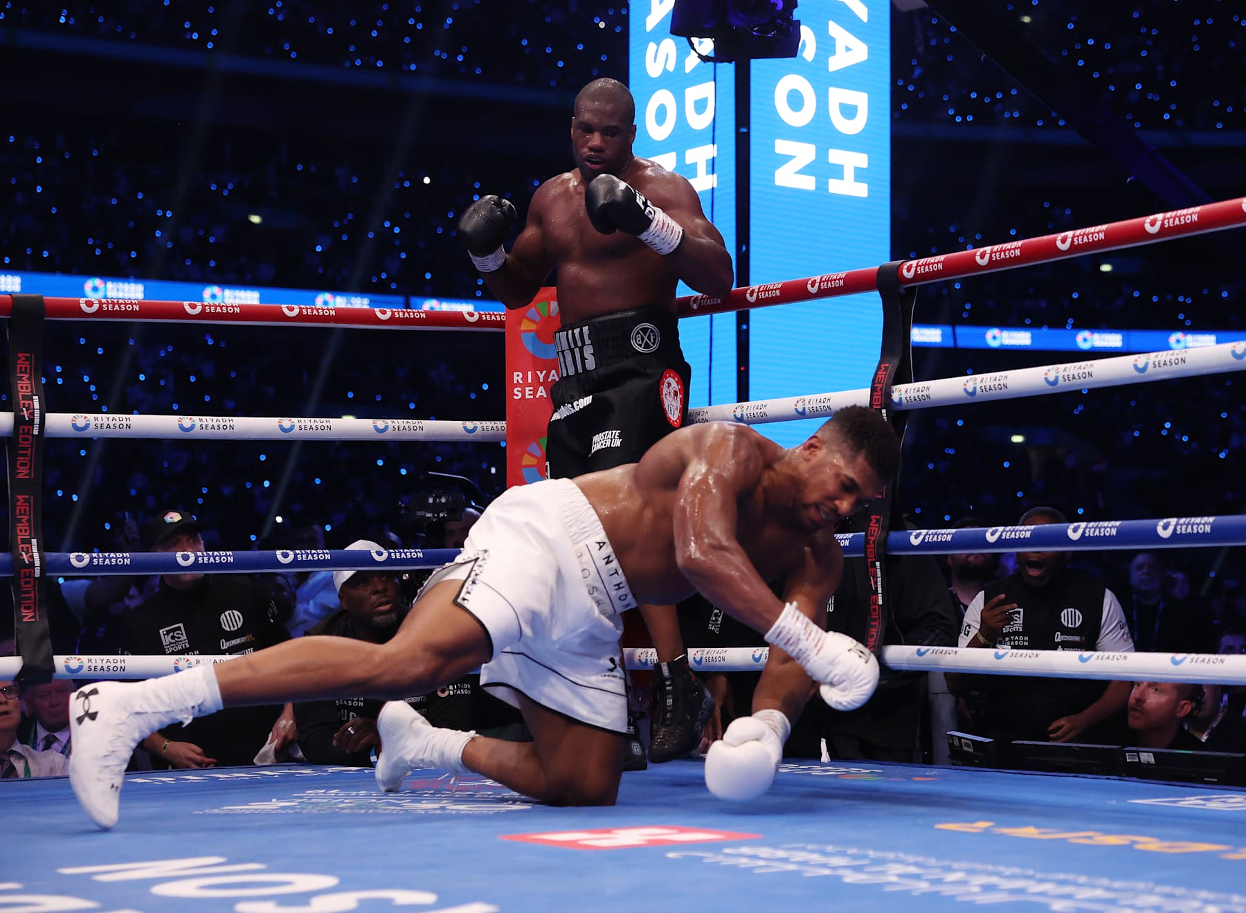 LONDON, ENGLAND - SEPTEMBER 21: Daniel Dubois stands as Anthony Joshua goes down during their IBF World Heavyweight Title fight at the Riyadh Season - Wembley Edition card at Wembley Stadium on September 21, 2024 in London, England. (Photo by Mark Robinson/Matchroom Boxing/Getty Images)
