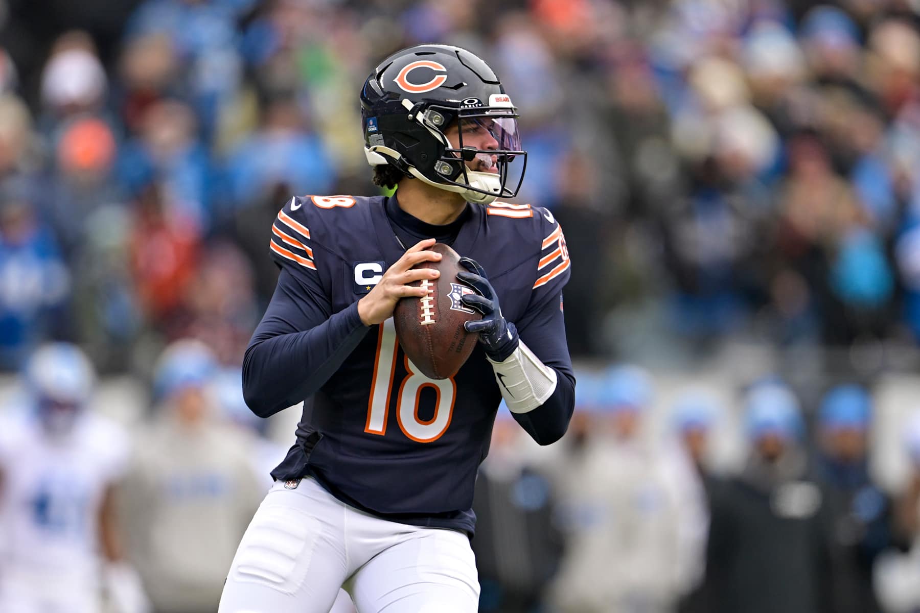 CHICAGO, ILLINOIS - DECEMBER 22: Caleb Williams #18 of the Chicago Bears looks to pass the ball against the Detroit Lions during the first quarter at Soldier Field on December 22, 2024 in Chicago, Illinois. (Photo by Quinn Harris/Getty Images)