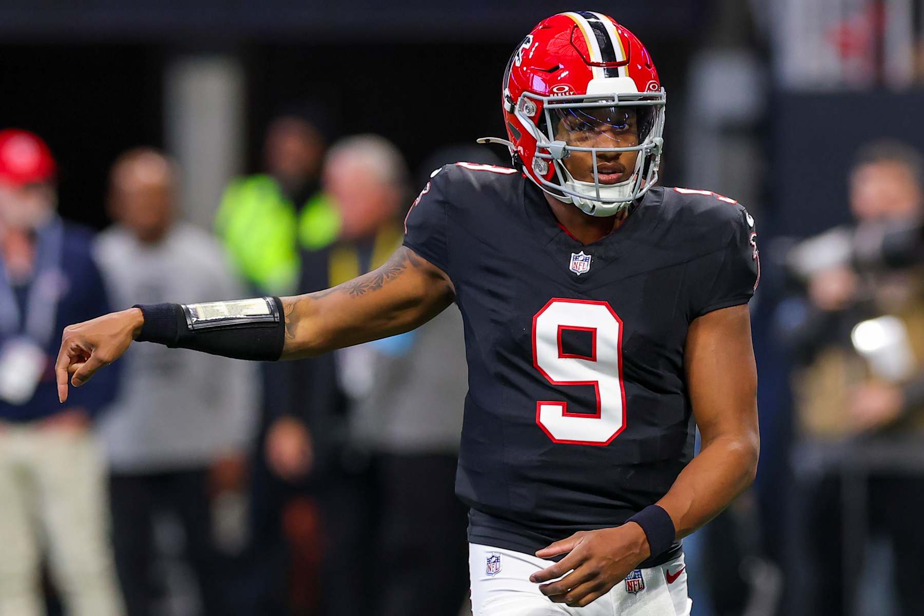 ATLANTA, GEORGIA - DECEMBER 22: Michael Penix Jr. #9 of the Atlanta Falcons runs onto the field during the first quarter against the New York Giants at Mercedes-Benz Stadium on December 22, 2024 in Atlanta, Georgia. (Photo by Kevin C. Cox/Getty Images)