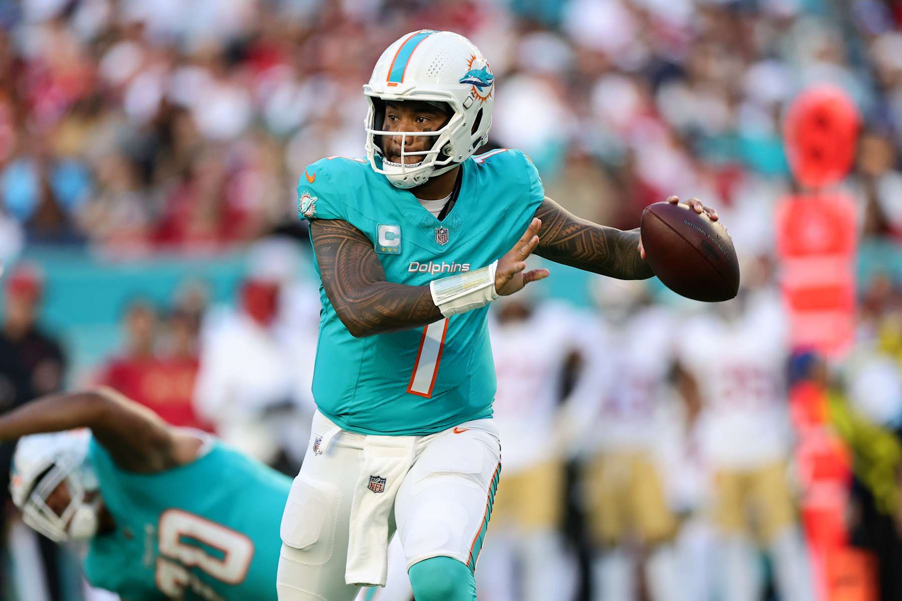 MIAMI GARDENS, FLORIDA - DECEMBER 22: Tua Tagovailoa #1 of the Miami Dolphins throws a pass during the first half against the San Francisco 49ers at Hard Rock Stadium on December 22, 2024 in Miami Gardens, Florida. (Photo by Carmen Mandato/Getty Images)