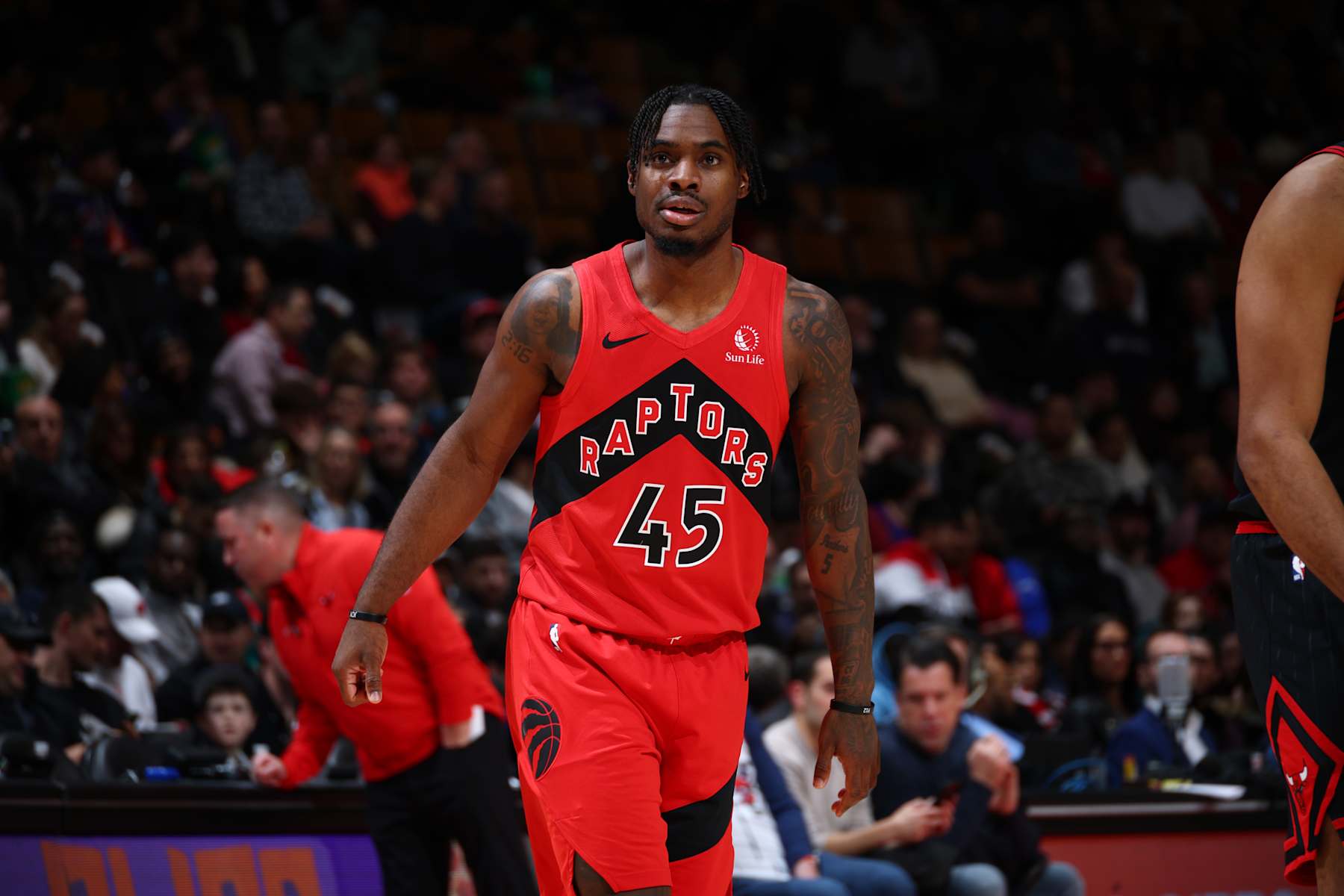 TORONTO, CANADA - DECEMBER 16: Davion Mitchell #45 of the Toronto Raptors looks on during the game against the Chicago Bulls on December 16, 2024 at the Scotiabank Arena in Toronto, Ontario, Canada.  NOTE TO USER: User expressly acknowledges and agrees that, by downloading and or using this Photograph, user is consenting to the terms and conditions of the Getty Images License Agreement.  Mandatory Copyright Notice: Copyright 2024 NBAE (Photo by Vaughn Ridley/NBAE via Getty Images)