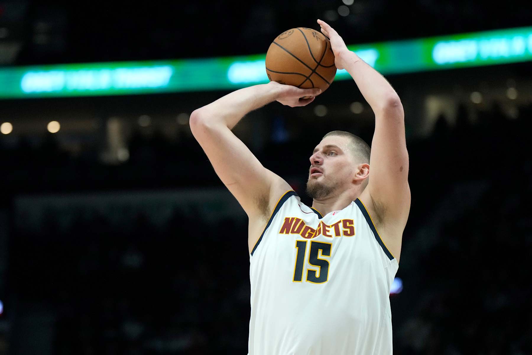 PORTLAND, OREGON - DECEMBER 19: Nikola Jokic #15 of the Denver Nuggets shoots a three point basket during the first half against the Portland Trail Blazers at Moda Center on December 19, 2024 in Portland, Oregon. NOTE TO USER: User expressly acknowledges and agrees that, by downloading and or using this photograph, User is consenting to the terms and conditions of the Getty Images License Agreement. (Photo by Soobum Im/Getty Images)