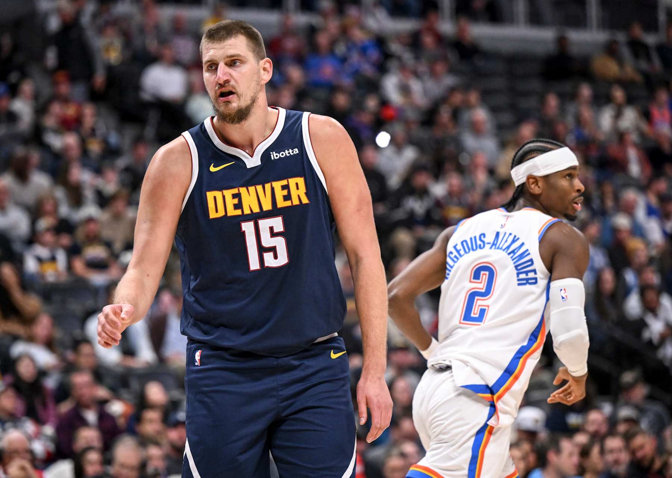 DENVER, CO - NOVEMBER 6: Nikola Jokic (15) of the Denver Nuggets reacts after giving up a bucket to Shai Gilgeous-Alexander (2) of the Oklahoma City Thunder during the first quarter at Ball Arena in Denver, Colorado on Wednesday, November 6, 2024. (Photo by AAron Ontiveroz/The Denver Post)