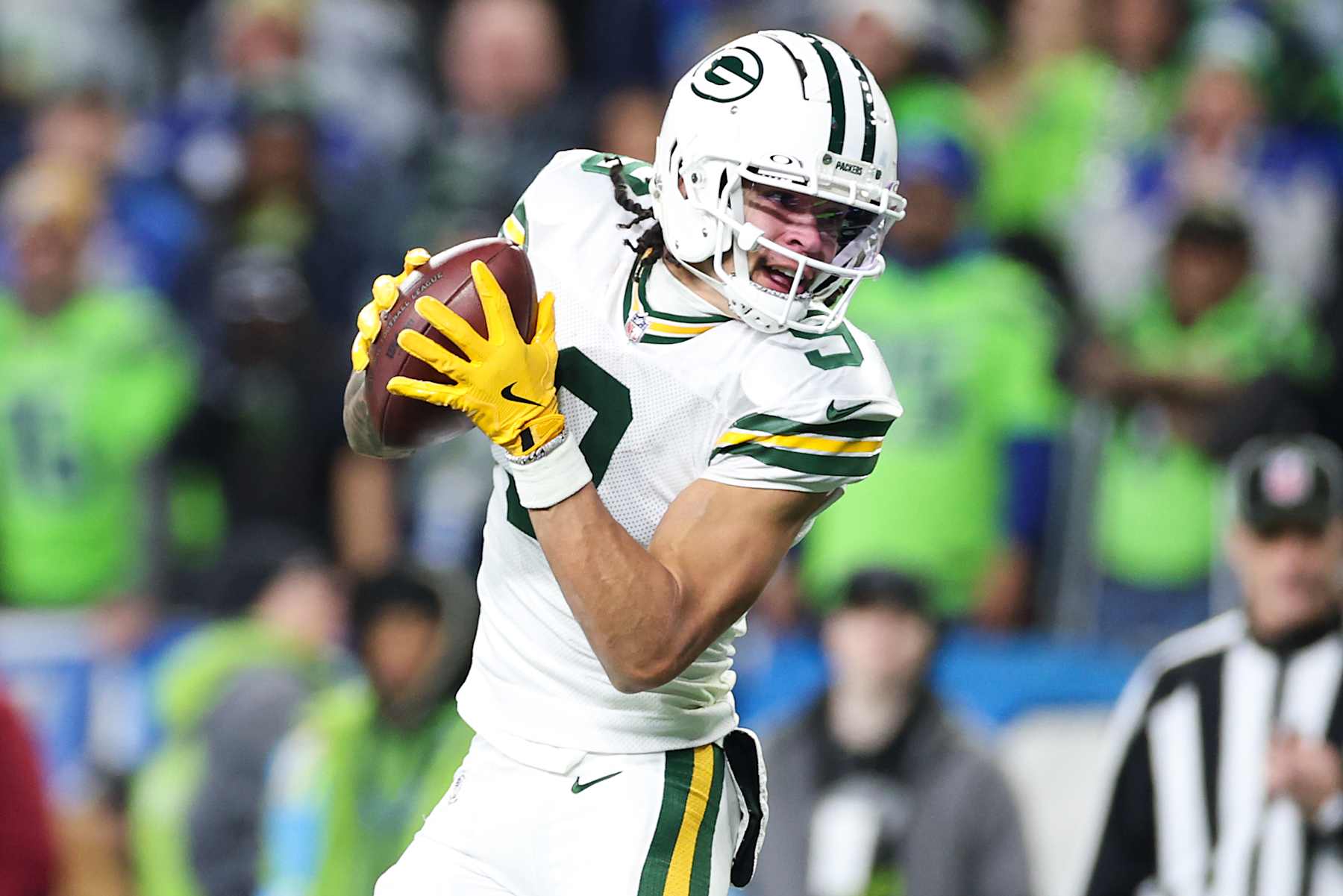 SEATTLE, WASHINGTON - DECEMBER 15: Christian Watson #9 of the Green Bay Packers catches a pass Seahawks during the third quarter at Lumen Field on December 15, 2024 in Seattle, Washington. (Photo by Steph Chambers/Getty Images)