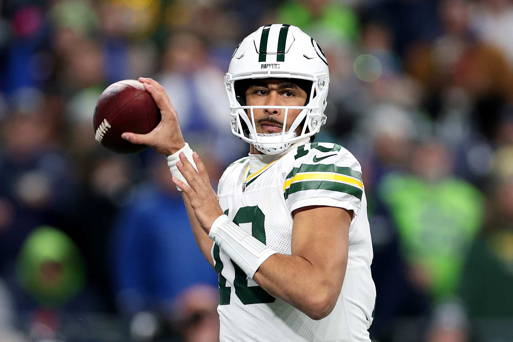 SEATTLE, WASHINGTON - DECEMBER 15: Jordan Love #10 of the Green Bay Packers passes against the Seattle Seahawks at Lumen Field on December 15, 2024 in Seattle, Washington. (Photo by Steph Chambers/Getty Images)