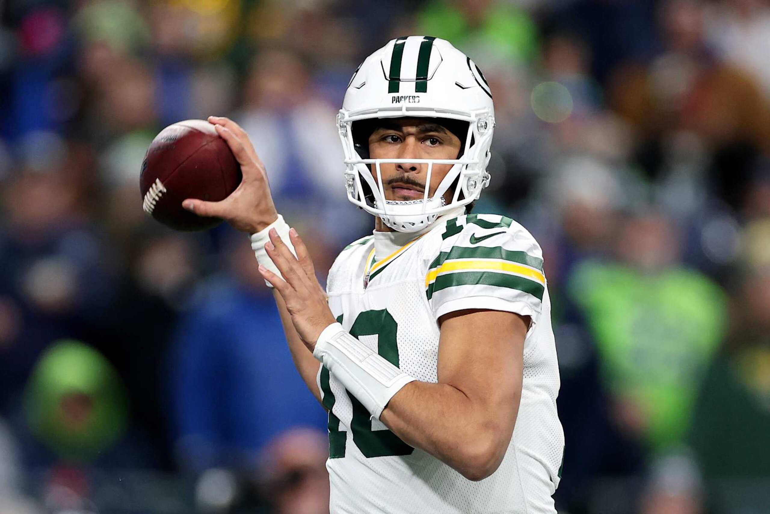 SEATTLE, WASHINGTON - DECEMBER 15: Jordan Love #10 of the Green Bay Packers passes against the Seattle Seahawks at Lumen Field on December 15, 2024 in Seattle, Washington. (Photo by Steph Chambers/Getty Images)