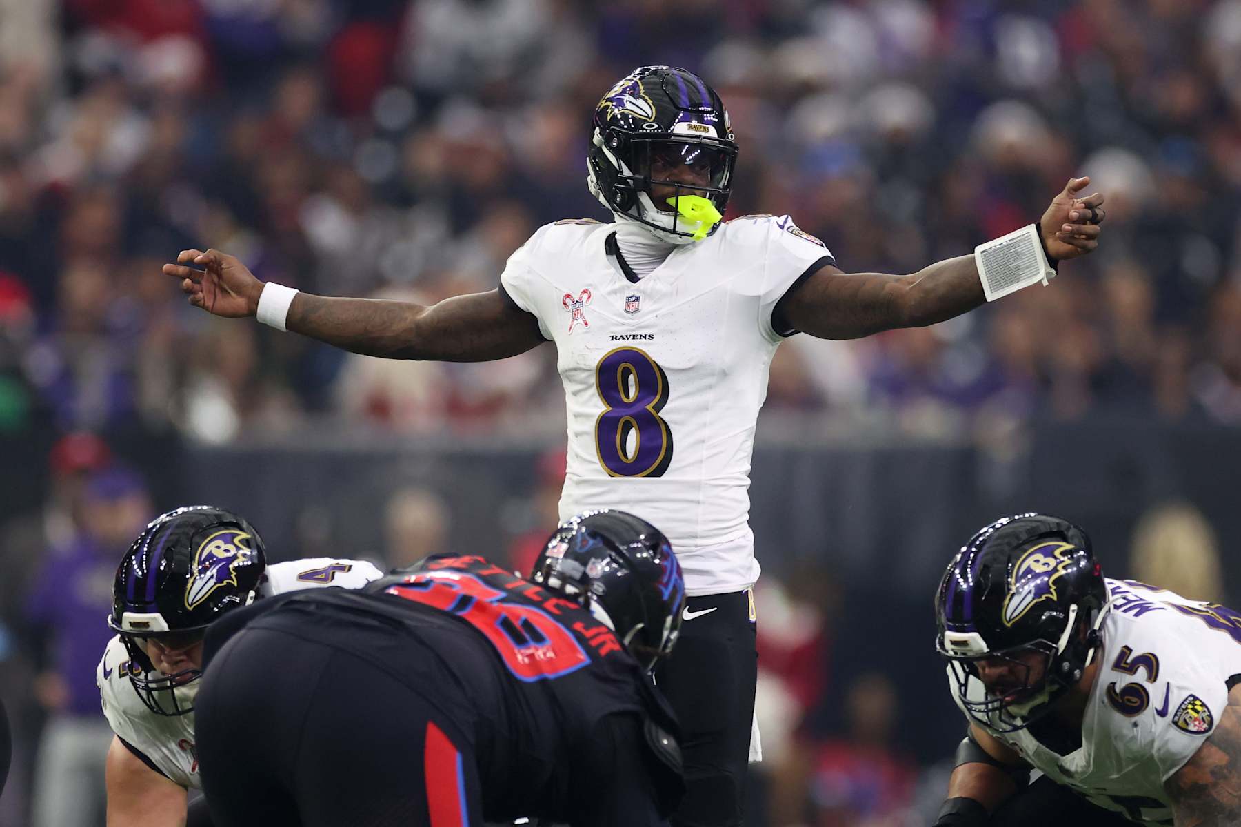 HOUSTON, TEXAS - DECEMBER 25: Lamar Jackson #8 of the Baltimore Ravens directs his team during the first quarter against the Houston Texans at NRG Stadium on December 25, 2024 in Houston, Texas. (Photo by Tim Warner/Getty Images)