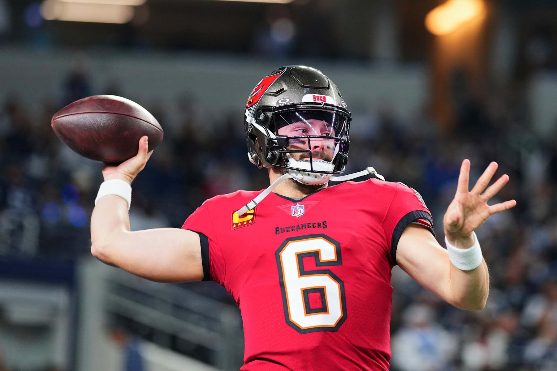 ARLINGTON, TX - DECEMBER 22: Baker Mayfield #6 of the Tampa Bay Buccaneers warms up before kickoff against the Dallas Cowboys during an NFL football game at AT&T Stadium on December 22, 2024 in Arlington, Texas. (Photo by Cooper Neill/Getty Images)