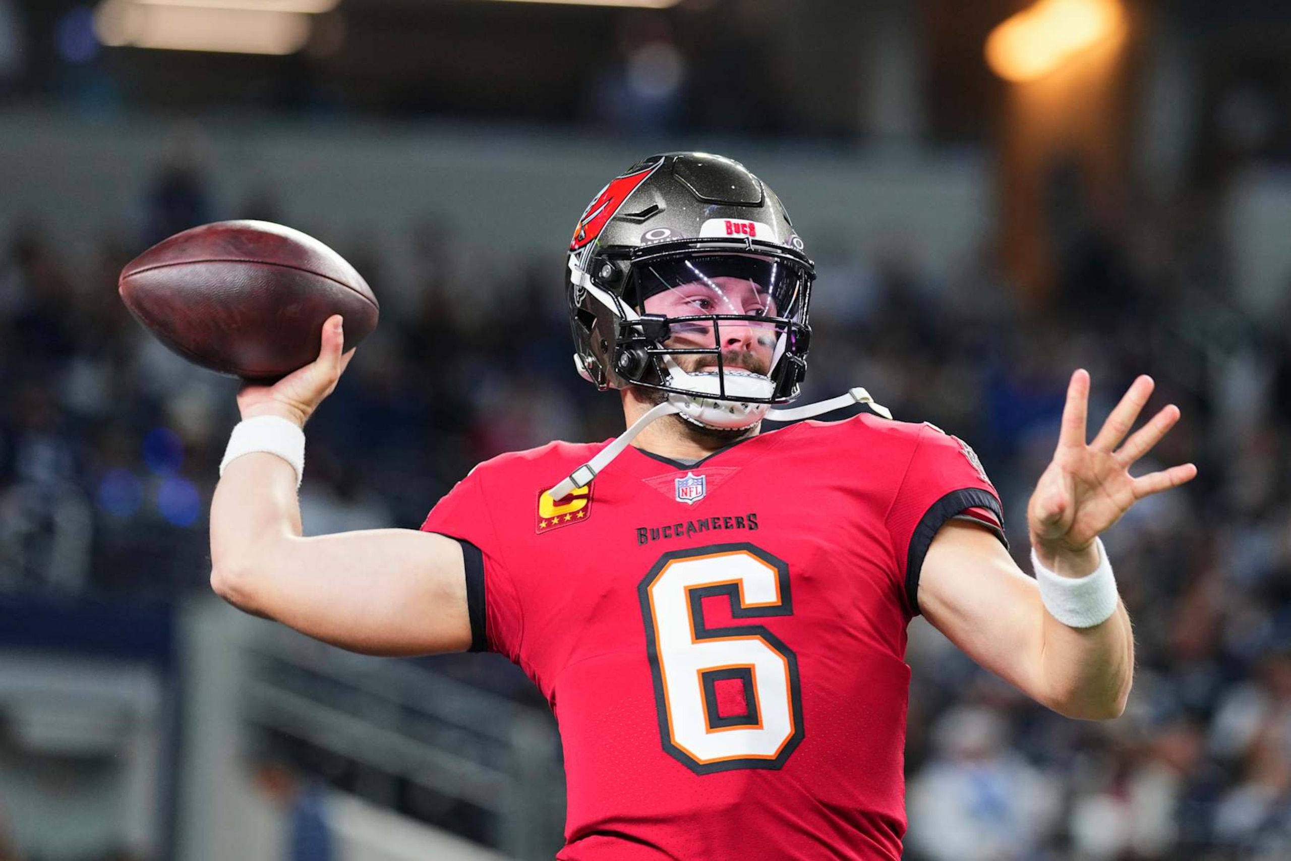 ARLINGTON, TX - DECEMBER 22: Baker Mayfield #6 of the Tampa Bay Buccaneers warms up before kickoff against the Dallas Cowboys during an NFL football game at AT&T Stadium on December 22, 2024 in Arlington, Texas. (Photo by Cooper Neill/Getty Images)