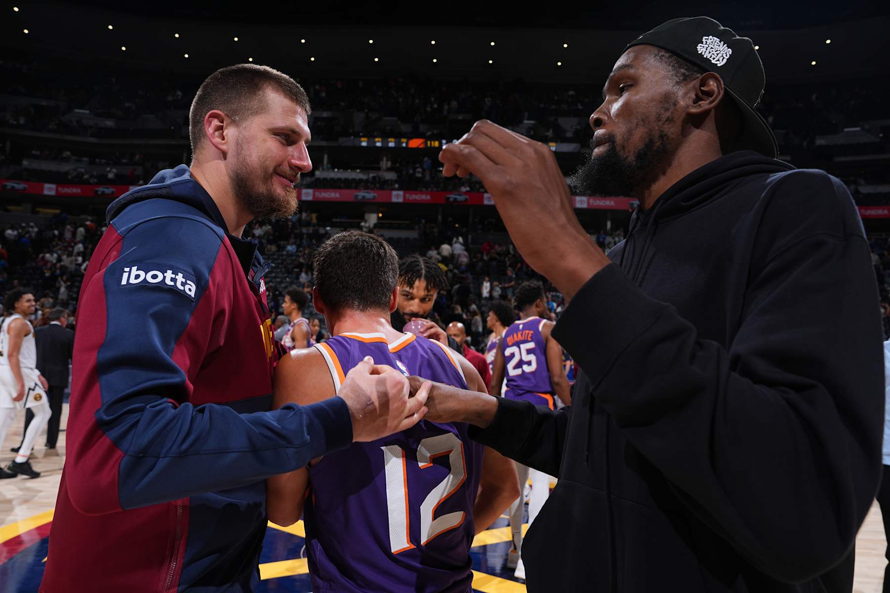 DENVER, CO - OCTOBER 13: Nikola Jokic #15 of the Denver Nuggets greets Kevin Durant #35 of the Phoenix Suns after the game on October 13, 2024 at Ball Arena in Denver, Colorado. NOTE TO USER: User expressly acknowledges and agrees that, by downloading and/or using this Photograph, user is consenting to the terms and conditions of the Getty Images License Agreement. Mandatory Copyright Notice: Copyright 2024 NBAE (Photo by Garrett Ellwood/NBAE via Getty Images)