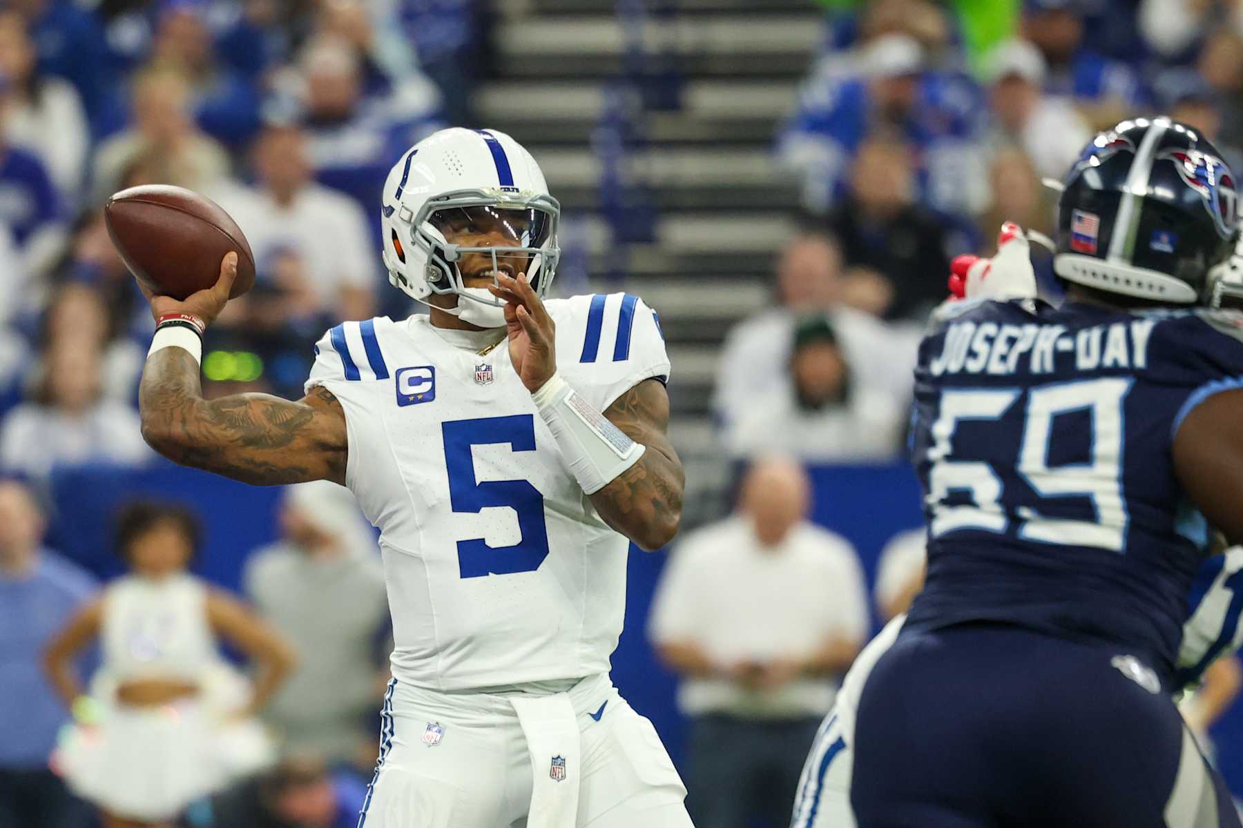 INDIANAPOLIS, INDIANA - DECEMBER 22: Anthony Richardson #5 of the Indianapolis Colts looks to pass against Sebastian Joseph-Day #69 of the Tennessee Titans during the first quarter at Lucas Oil Stadium on December 22, 2024 in Indianapolis, Indiana. (Photo by Andy Lyons/Getty Images)