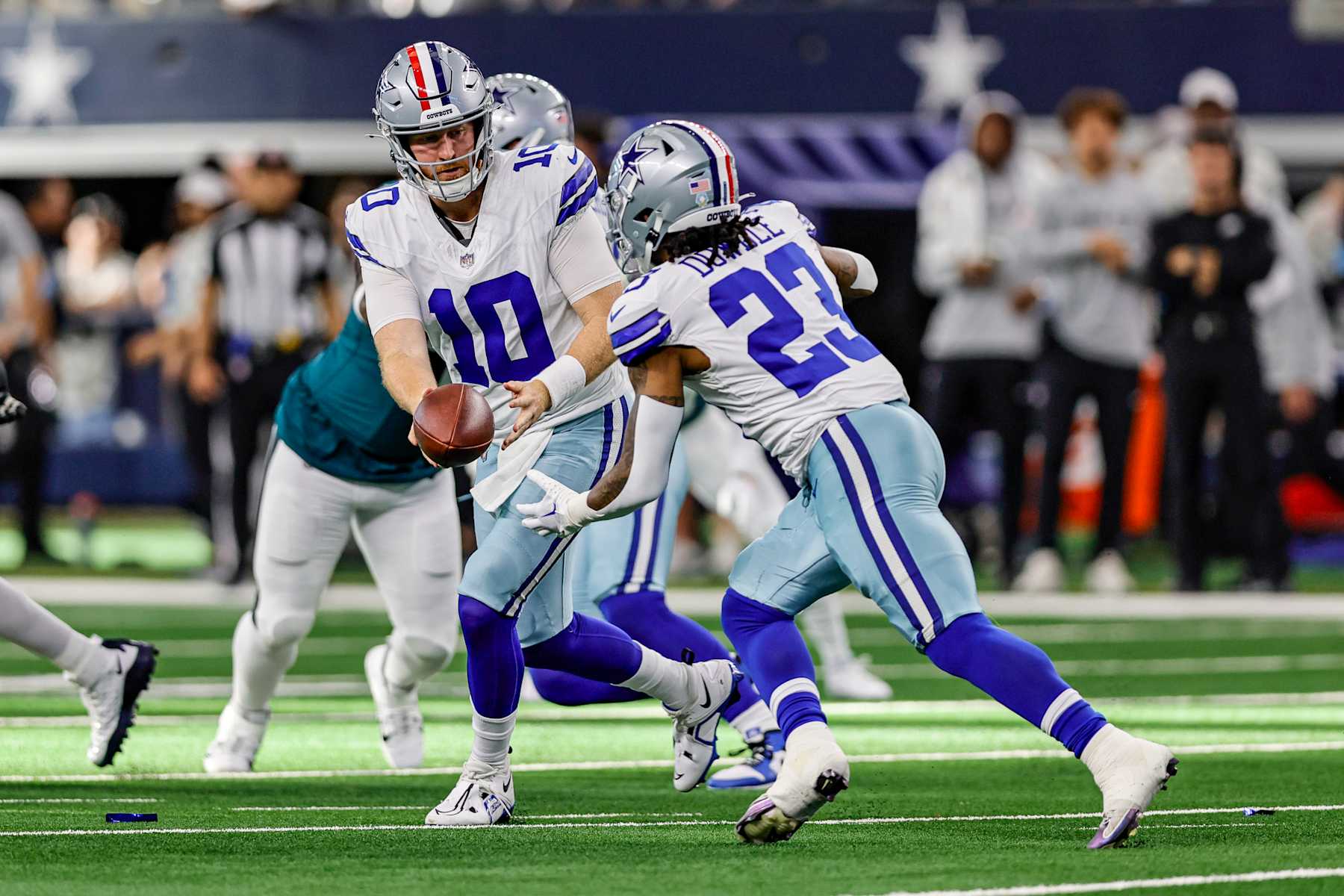 Cooper Rush hands off to Rico Dowdle