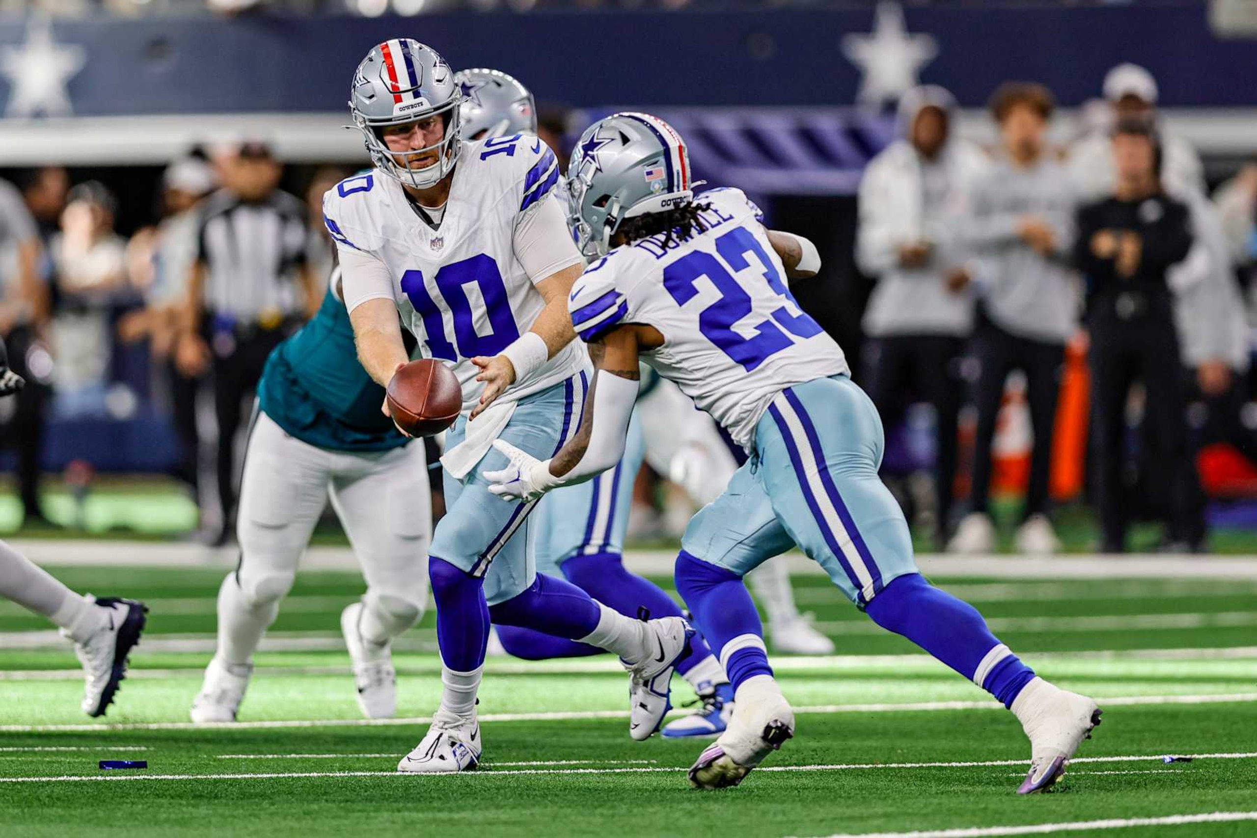 Cooper Rush hands off to Rico Dowdle