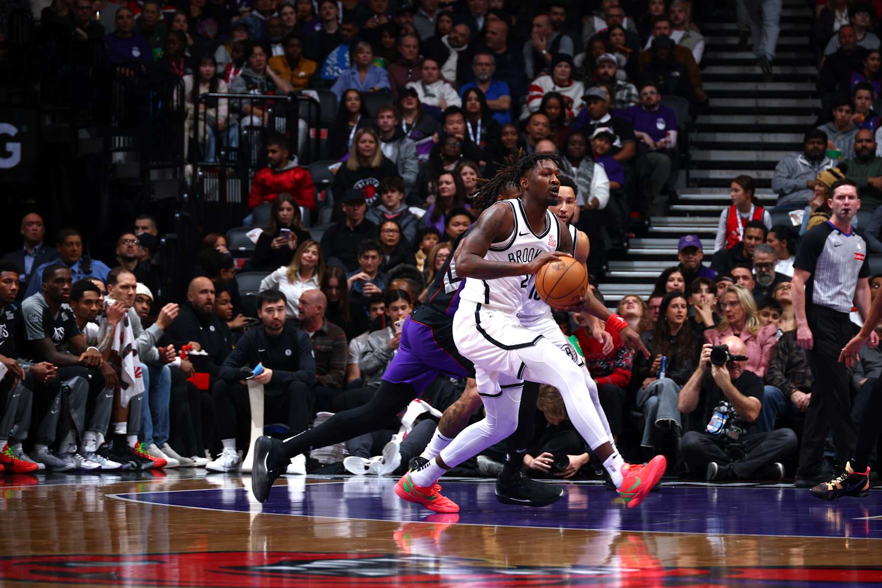 TORONTO, CANADA - DECEMBER 19:  Dorian Finney-Smith #28 of the Brooklyn Nets handles the ball during the game against the Toronto Raptors during a regular season game on December 19, 2024 at the Scotiabank Arena in Toronto, Ontario, Canada.  NOTE TO USER: User expressly acknowledges and agrees that, by downloading and or using this Photograph, user is consenting to the terms and conditions of the Getty Images License Agreement.  Mandatory Copyright Notice: Copyright 2024 NBAE (Photo by Vaughn Ridley/NBAE via Getty Images)