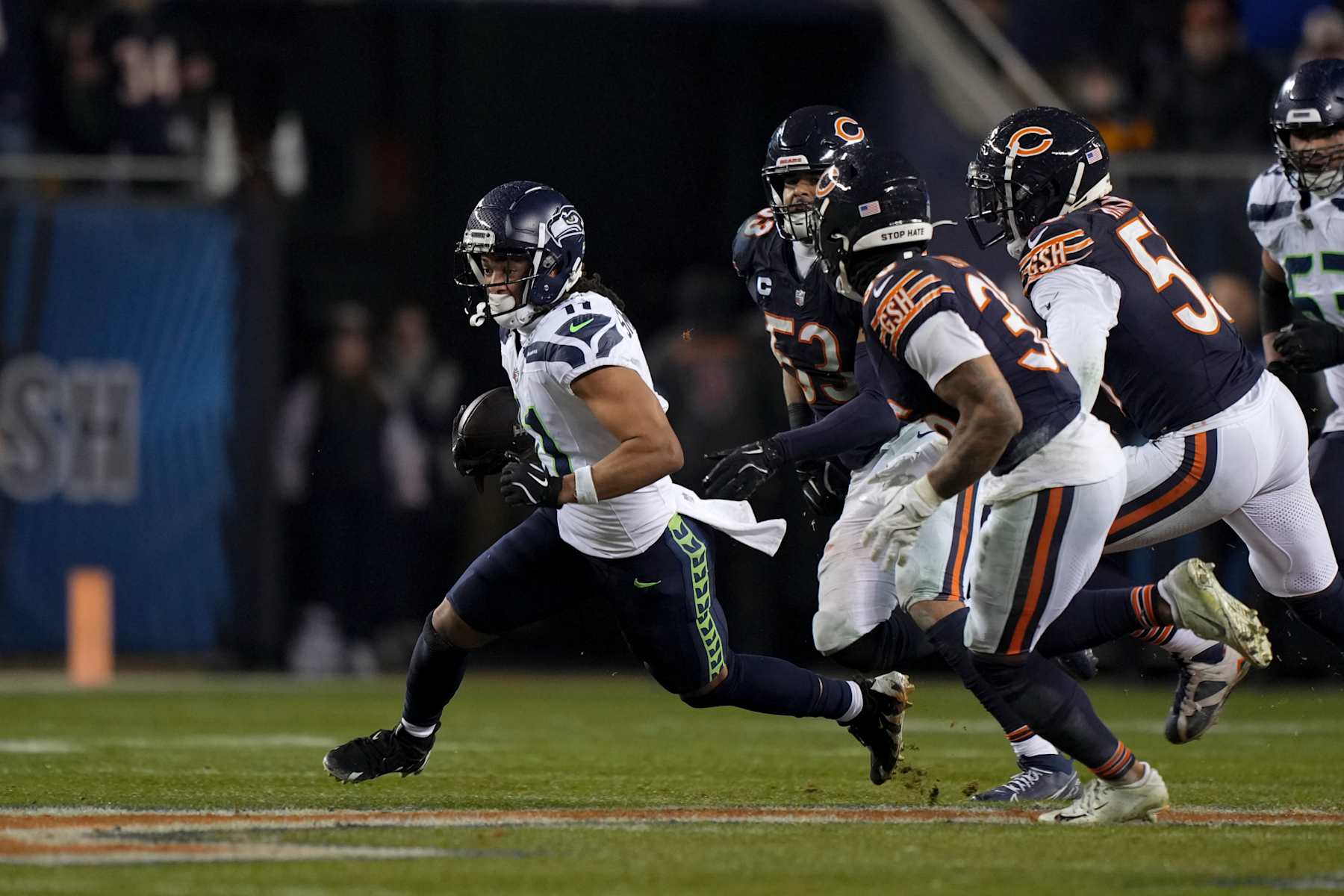CHICAGO, ILLINOIS - DECEMBER 26: Wide receiver Jaxon Smith-Njigba #11 of the Seattle Seahawks runs the ball during the second half of an NFL game against the Chicago Bears at Soldier Field on December 26, 2024 in Chicago, Illinois. (Photo by Todd Rosenberg/Getty Images)