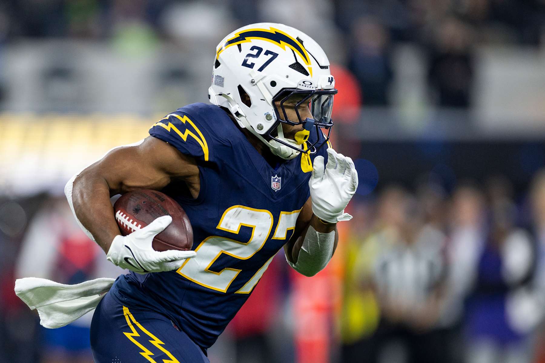 INGLEWOOD, CALIFORINA - NOVEMBER 25: J.K. Dobbins #27 of the Los Angeles Chargers runs with the ball during an NFL Football game against the Baltimore Ravens at SoFi Stadium on November 25, 2024 in Inglewood, Califorina. (Photo by Michael Owens/Getty Images)