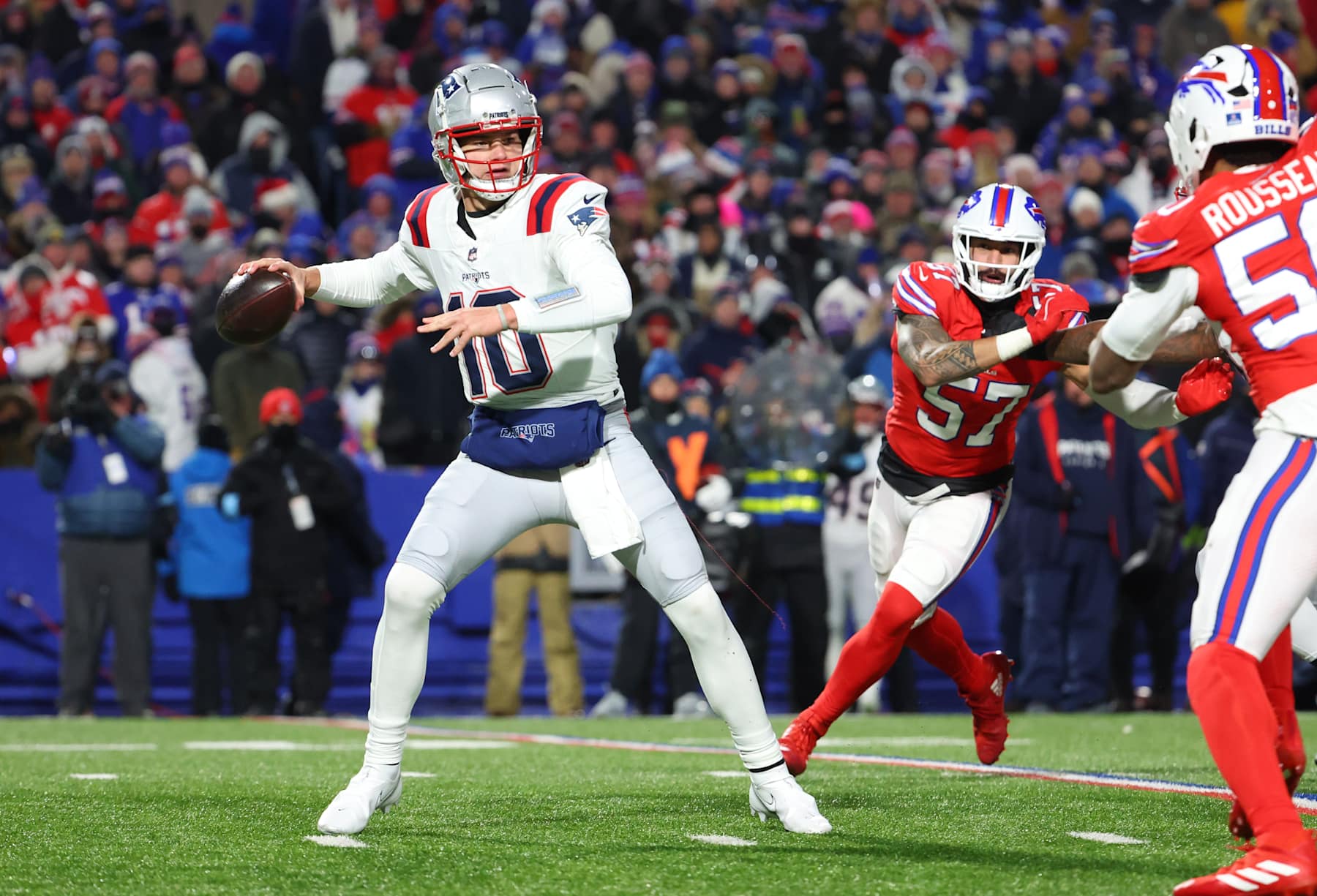 ORCHARD PARK, NEW YORK - DECEMBER 22: Drake Maye #10 of the New England Patriots looks to throw a pass during a game against the Buffalo Bills at Highmark Stadium on December 22, 2024 in Orchard Park, New York. (Photo by Timothy T Ludwig/Getty Images)