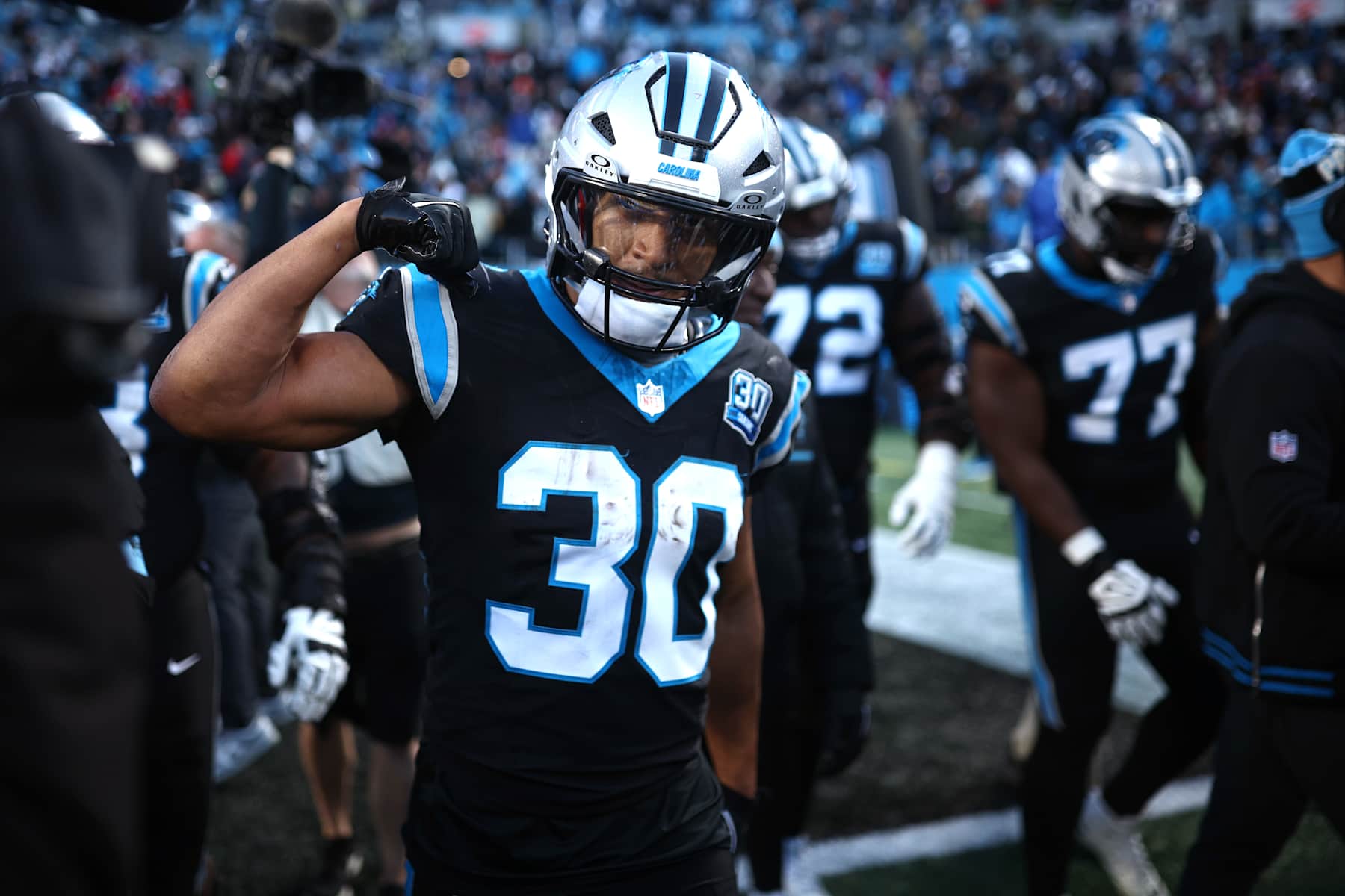 CHARLOTTE, NORTH CAROLINA - DECEMBER 22: Chuba Hubbard #30 of the Carolina Panthers celebrates after scoring a rushing touchdown against the Arizona Cardinals during overtime at Bank of America Stadium on December 22, 2024 in Charlotte, North Carolina. (Photo by Jared C. Tilton/Getty Images)