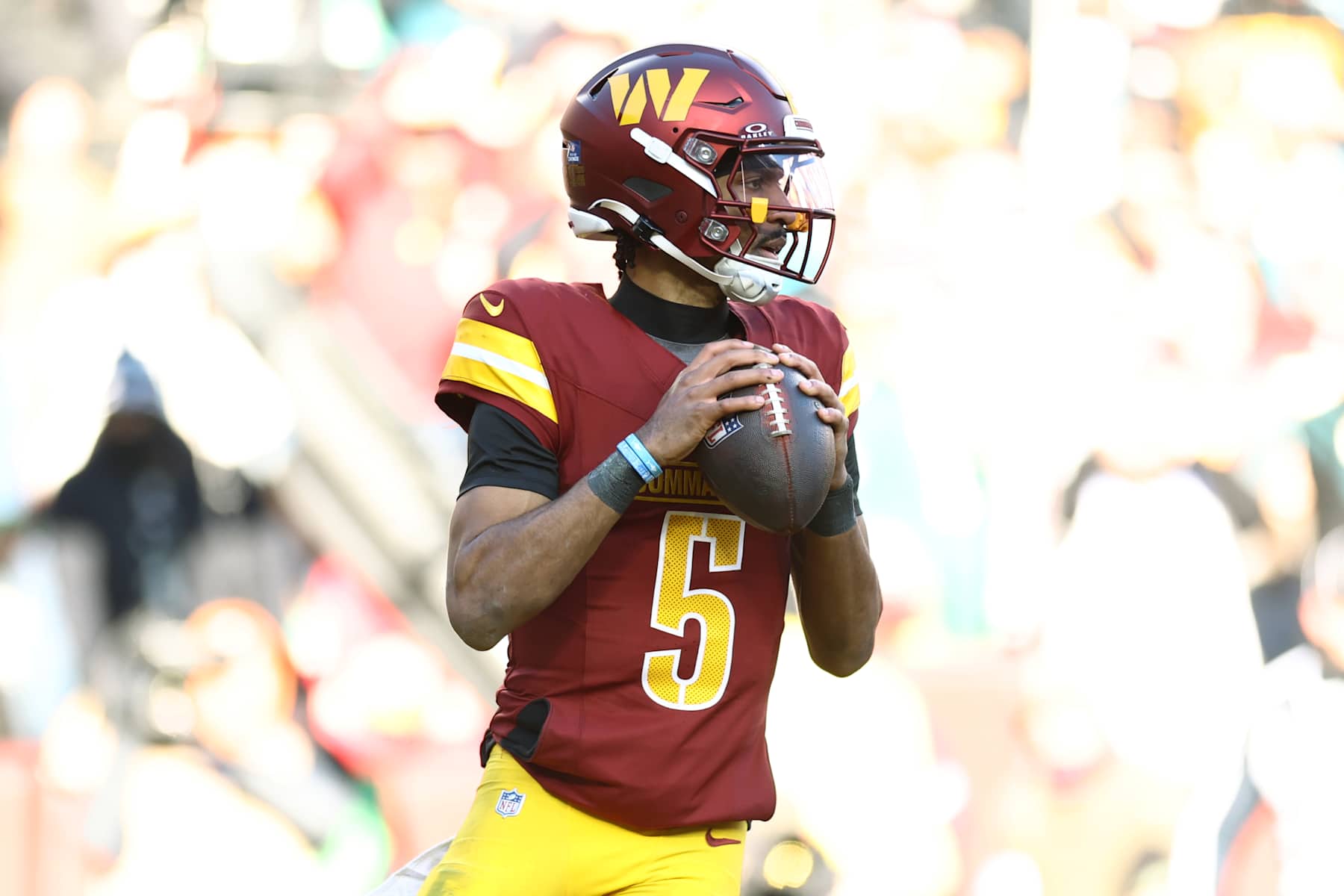LANDOVER, MARYLAND - DECEMBER 22: Jayden Daniels #5 of the Washington Commanders drops back to pass against the Philadelphia Eagles at Northwest Stadium on December 22, 2024 in Landover, Maryland. (Photo by Timothy Nwachukwu/Getty Images)
