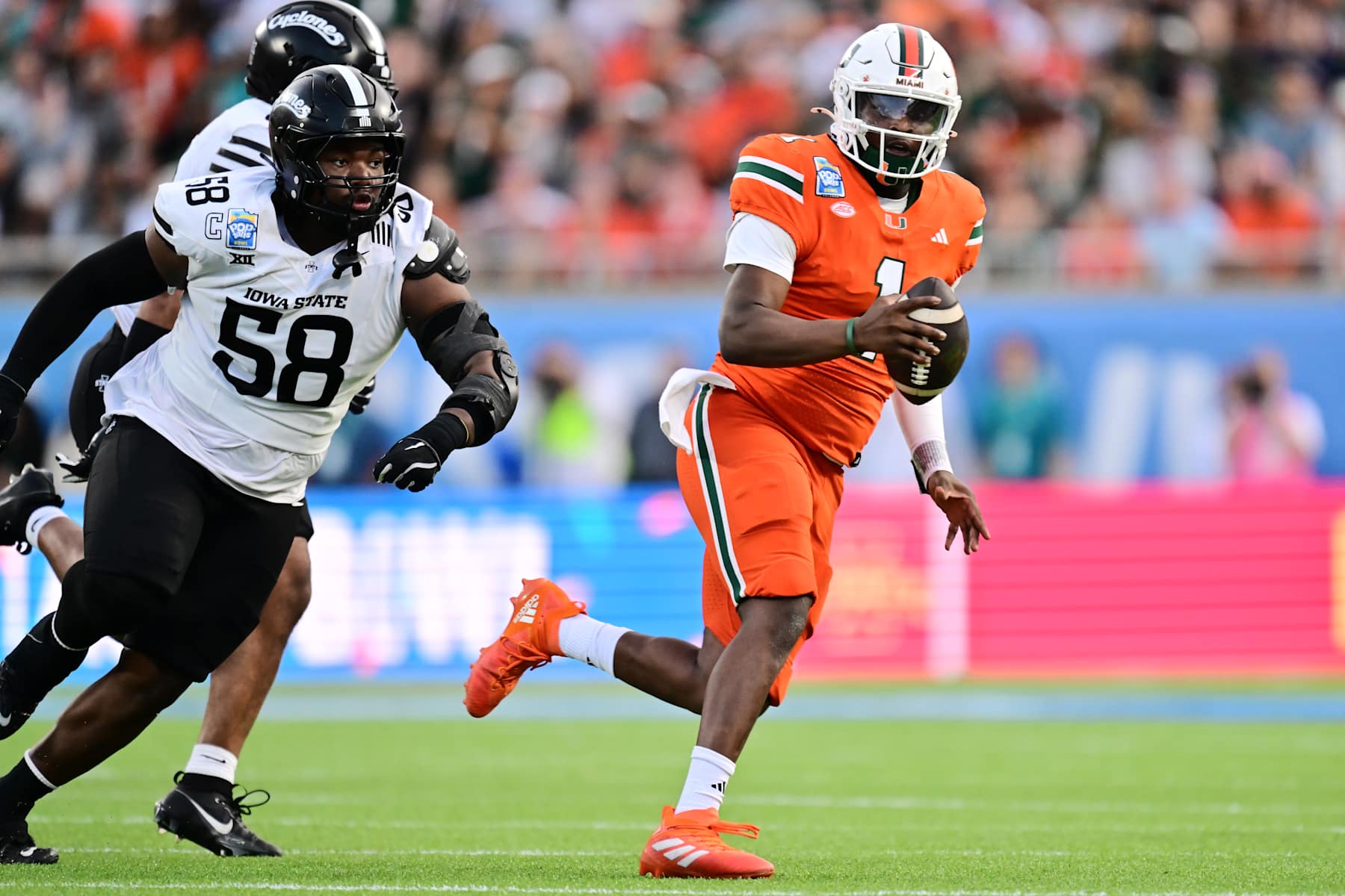 ORLANDO, FLORIDA - DECEMBER 28: Cam Ward #1 of the Miami Hurricanes scrambles with the ball in the second quarter against the Iowa State Cyclones during the 2024 Pop-Tarts Bowl at Camping World Stadium on December 28, 2024 in Orlando, Florida. (Photo by Julio Aguilar/Getty Images)