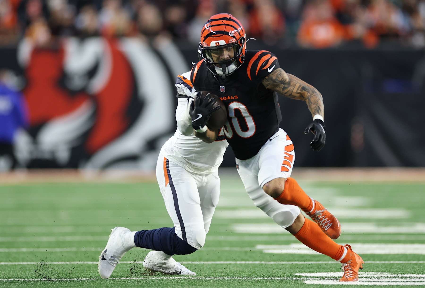 CINCINNATI, OHIO - DECEMBER 28: Chase Brown #30 of the Cincinnati Bengals runs with the ball during the second quarter against the Denver Broncos at Paycor Stadium on December 28, 2024 in Cincinnati, Ohio. (Photo by Andy Lyons/Getty Images)