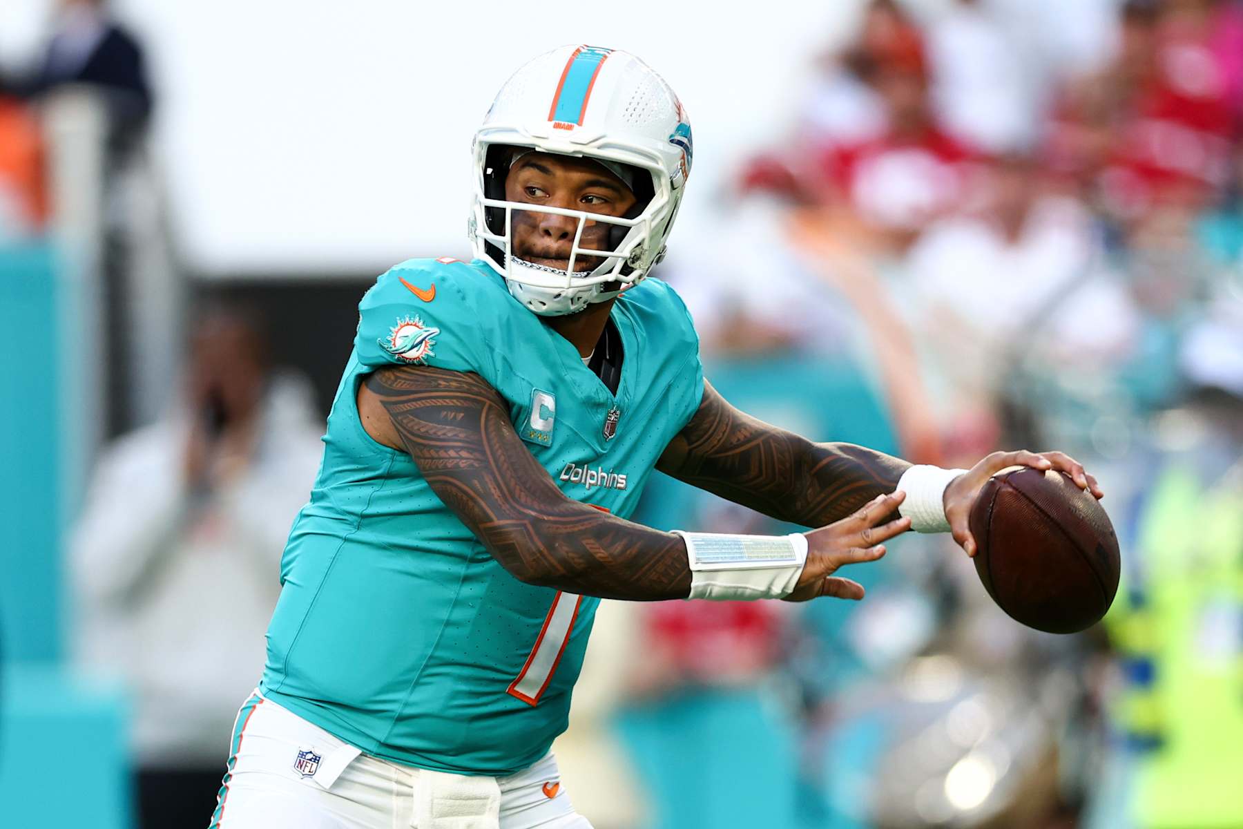 MIAMI GARDENS, FLORIDA - DECEMBER 22: Tua Tagovailoa #1 of the Miami Dolphins looks to throw a pass during the first half of an NFL football game against the San Francisco 49ers at Hard Rock Stadium on December 22, 2024 in Miami Gardens, Florida. (Photo by Kevin Sabitus/Getty Images)