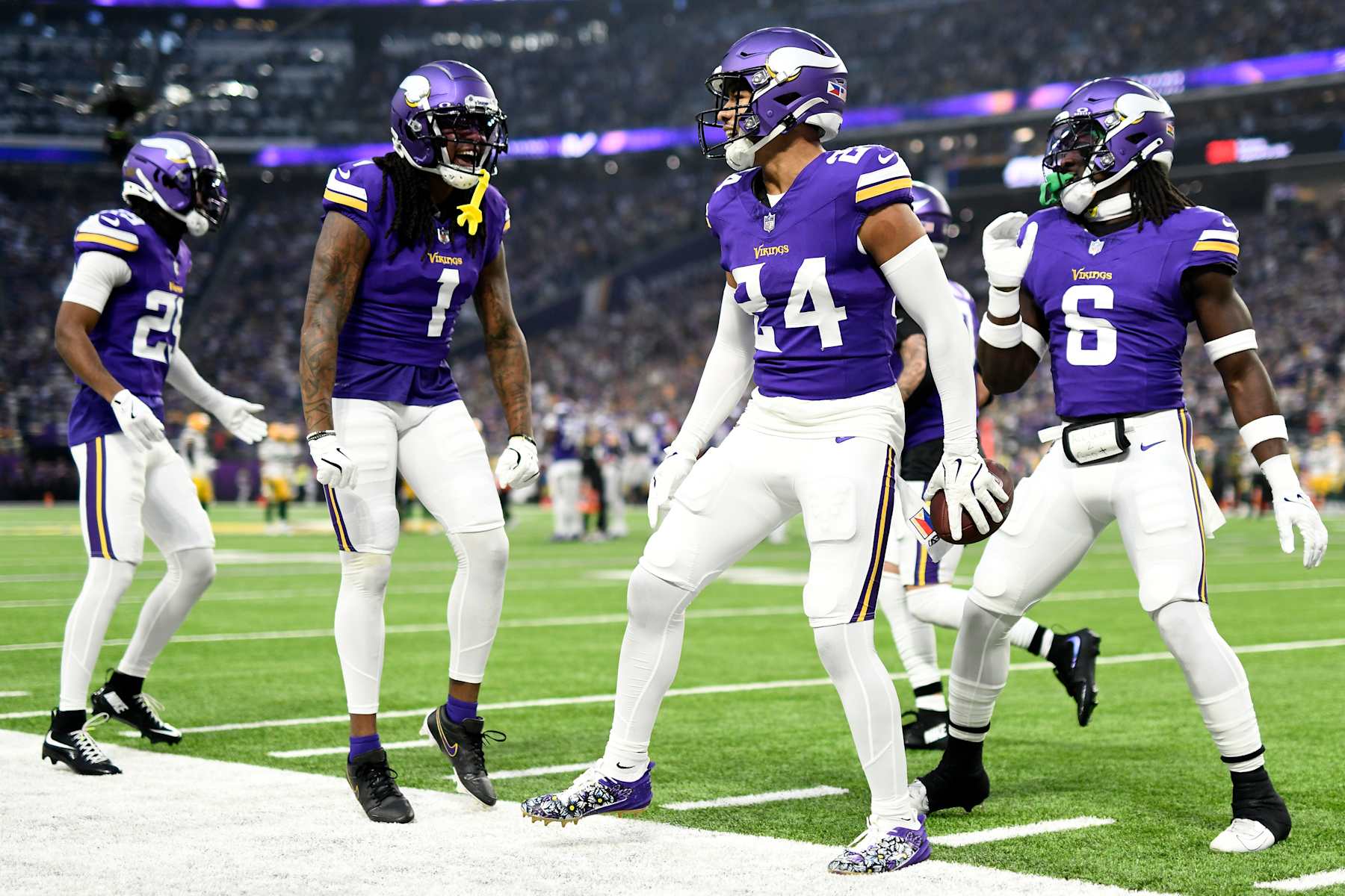 MINNEAPOLIS, MINNESOTA - DECEMBER 29: Camryn Bynum #24 of the Minnesota Vikings celebrates with teammates after a fumble recovery during the first quarter against the Green Bay Packers at U.S. Bank Stadium on December 29, 2024 in Minneapolis, Minnesota. (Photo by Stephen Maturen/Getty Images)