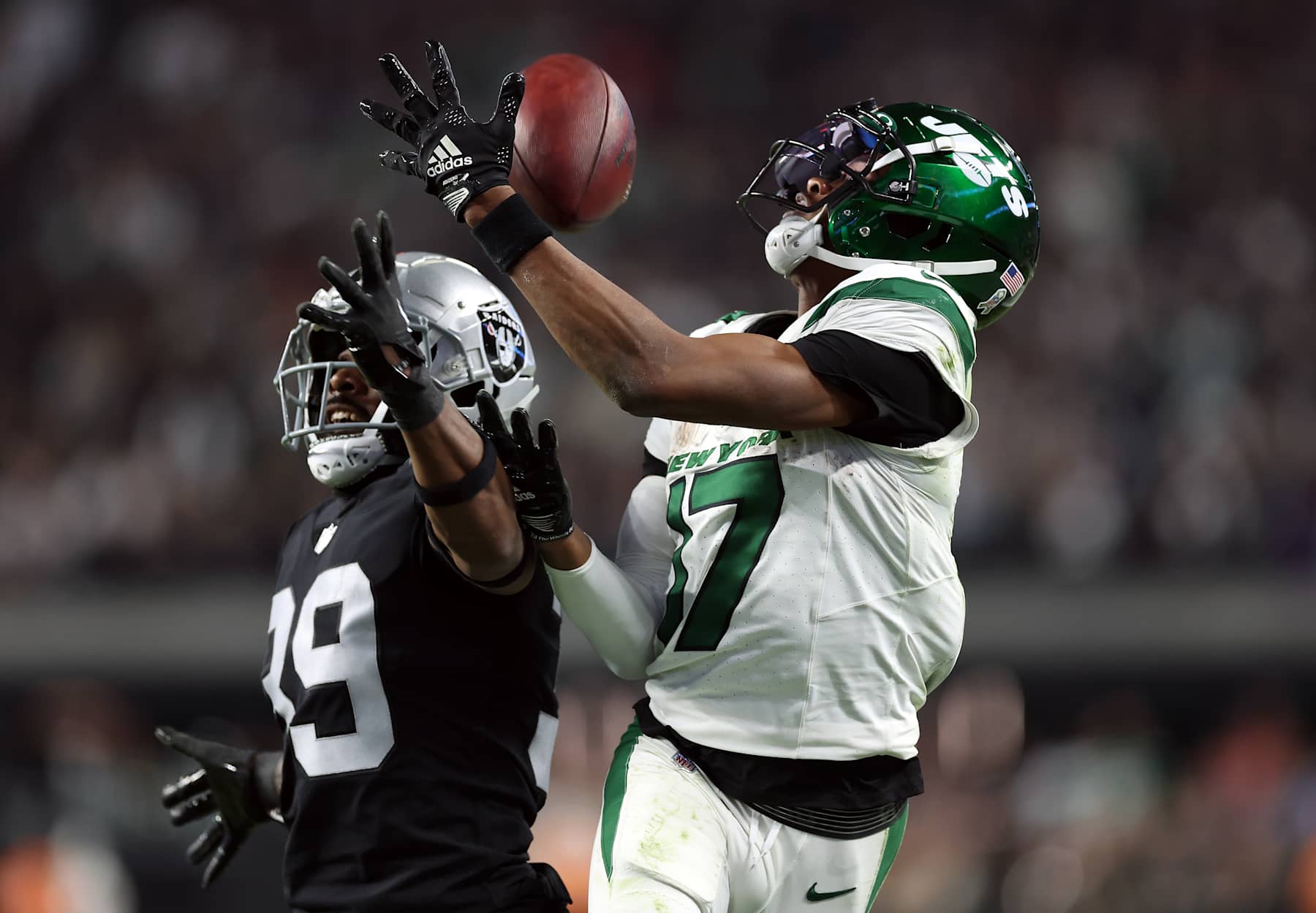 LAS VEGAS, NEVADA - NOVEMBER 12: Wide receiver Garrett Wilson #17 of the New York Jets cannot hold on to the ball as cornerback Nate Hobbs #39 of the Las Vegas Raiders breaks up the pass during the 4th quarter of the game at Allegiant Stadium on November 12, 2023 in Las Vegas, Nevada. (Photo by Sean M. Haffey/Getty Images)