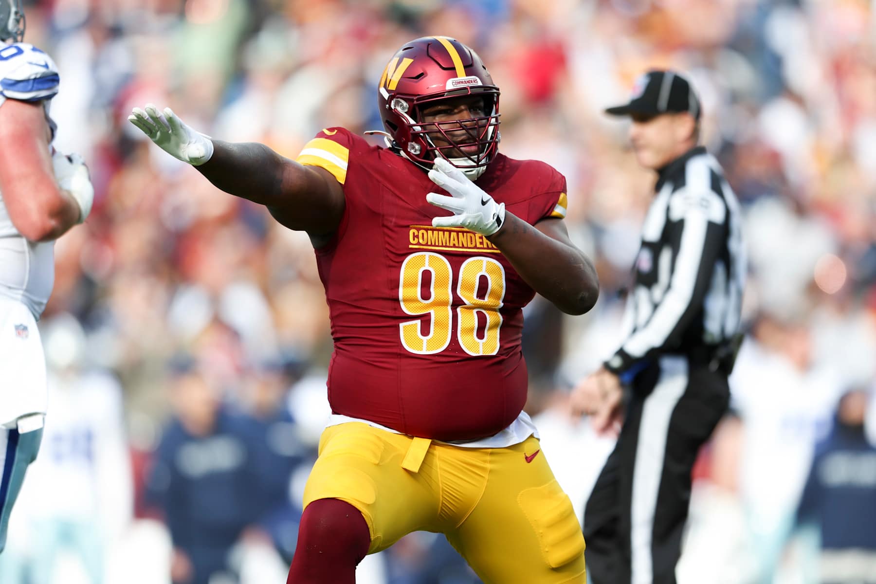 LANDOVER, MARYLAND - NOVEMBER 24: Phidarian Mathis #98 of the Washington Commanders celebrates after a play during a game against the Dallas Cowboys at Northwest Stadium on November 24, 2024 in Landover, Maryland. The Cowboys defeated the Commanders 34-26. (Kara Durrette/Getty Images)