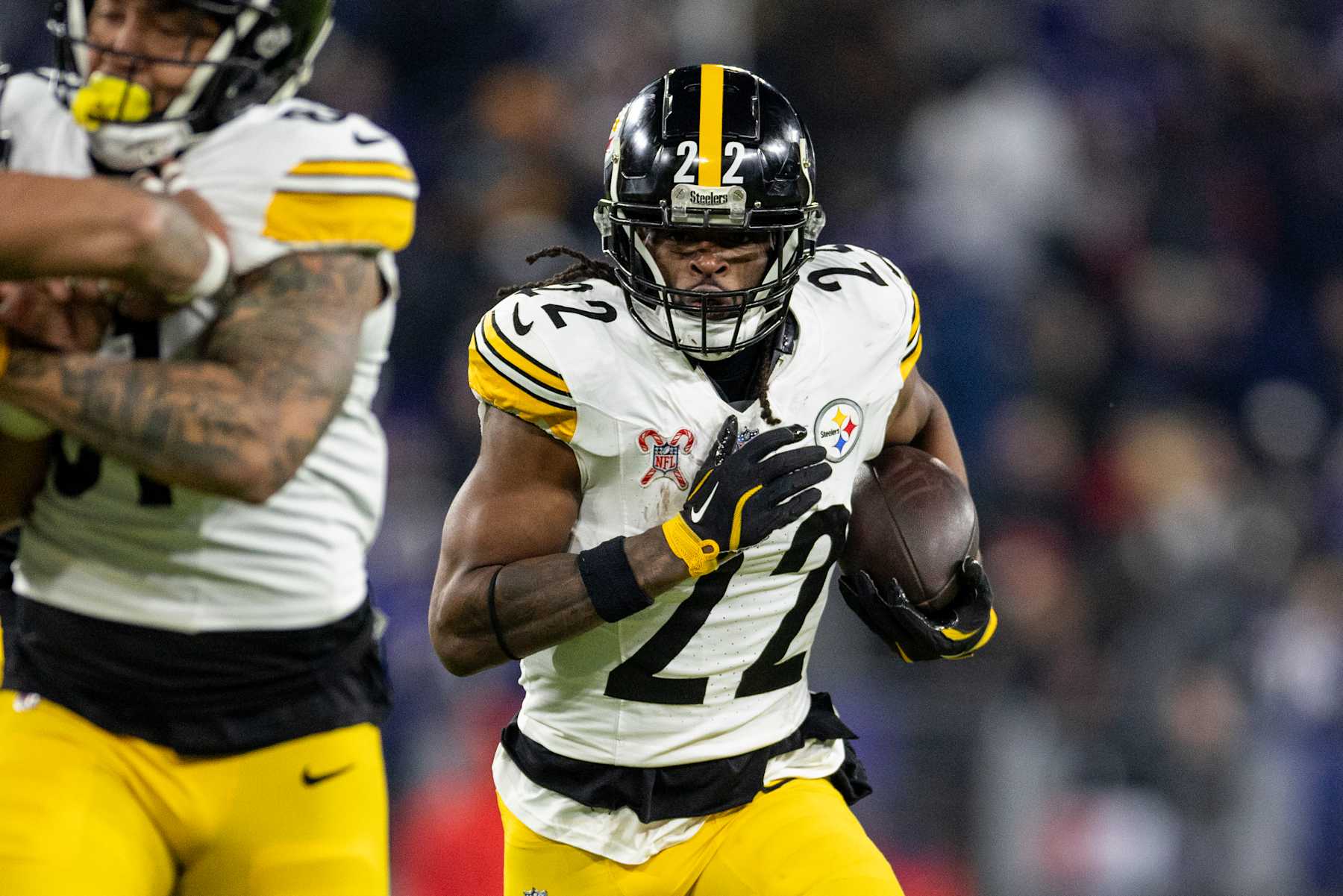 BALTIMORE, MARYLAND - DECEMBER 21: Najee Harris #22 of the Pittsburgh Steelers runs with the ball during an NFL Football game against the Baltimore Ravens at M&T Bank Stadium on December 21, 2024 in Baltimore, Maryland. (Photo by Michael Owens/Getty Images)