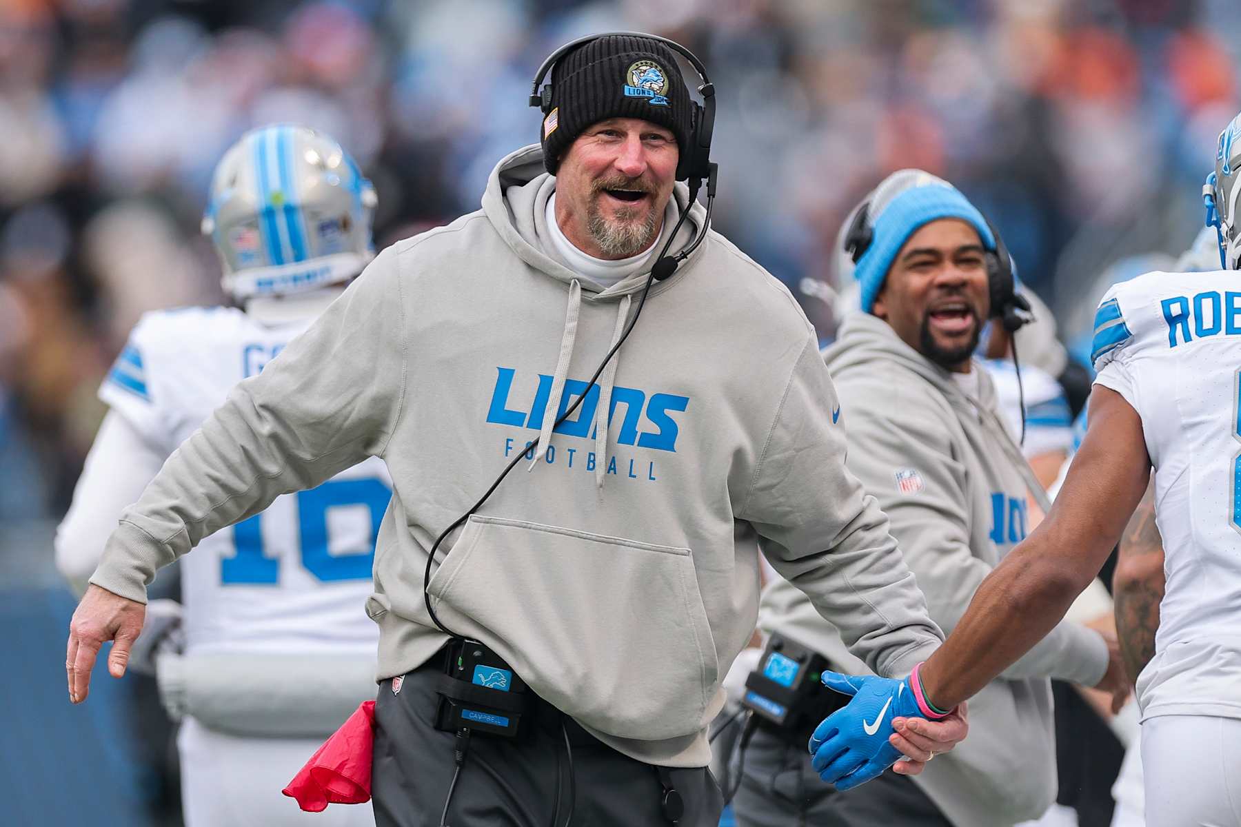 CHICAGO, ILLINOIS - DECEMBER 22: Head coach Dan Campbell of the Detroit Lions celebrates after his team's touchdown against the Chicago Bears during the third quarter at Soldier Field on December 22, 2024 in Chicago, Illinois. (Photo by Michael Reaves/Getty Images)