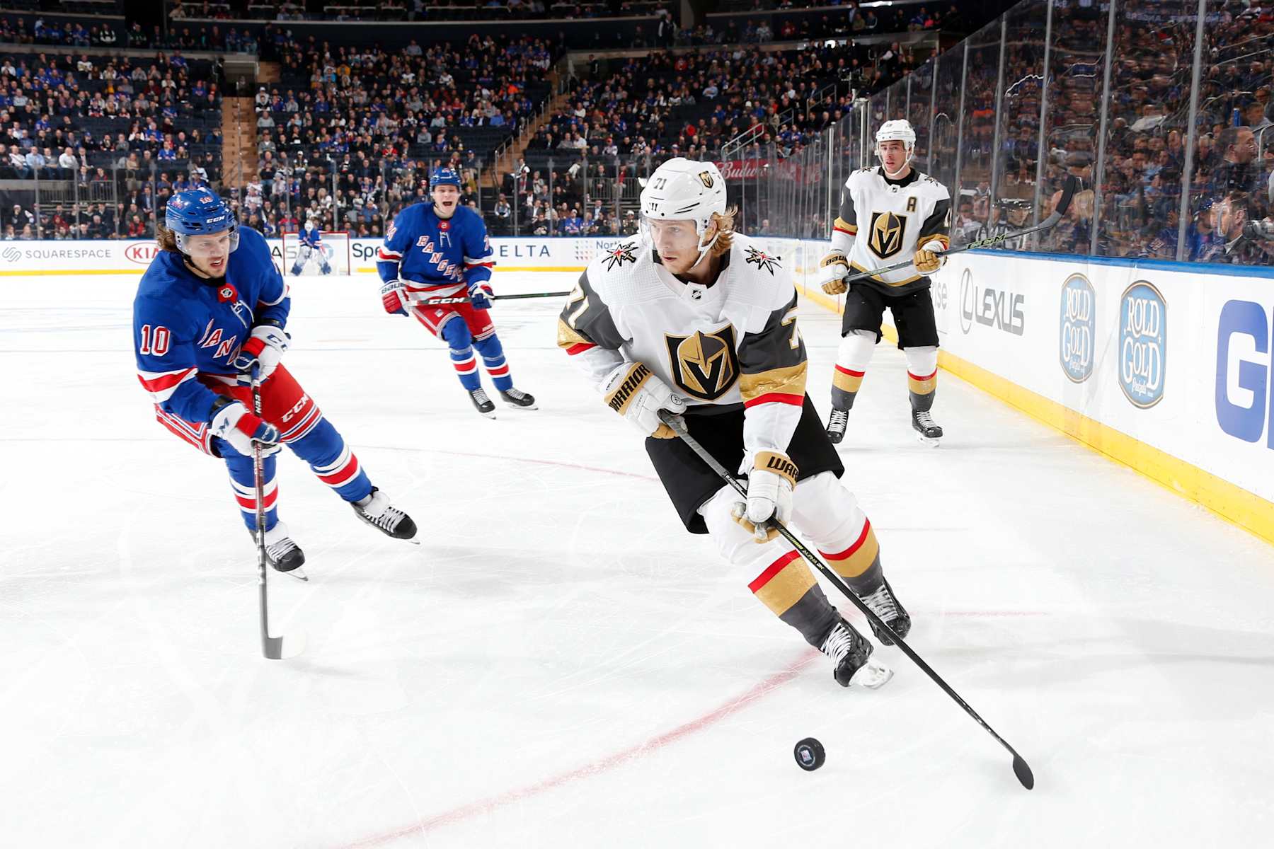 NEW YORK, NY - DECEMBER 02: William Karlsson #71 of the Vegas Golden Knights skates with the puck against Artemi Panarin #10 of the New York Rangers at Madison Square Garden on December 2, 2019 in New York City. (Photo by Jared Silber/NHLI via Getty Images)