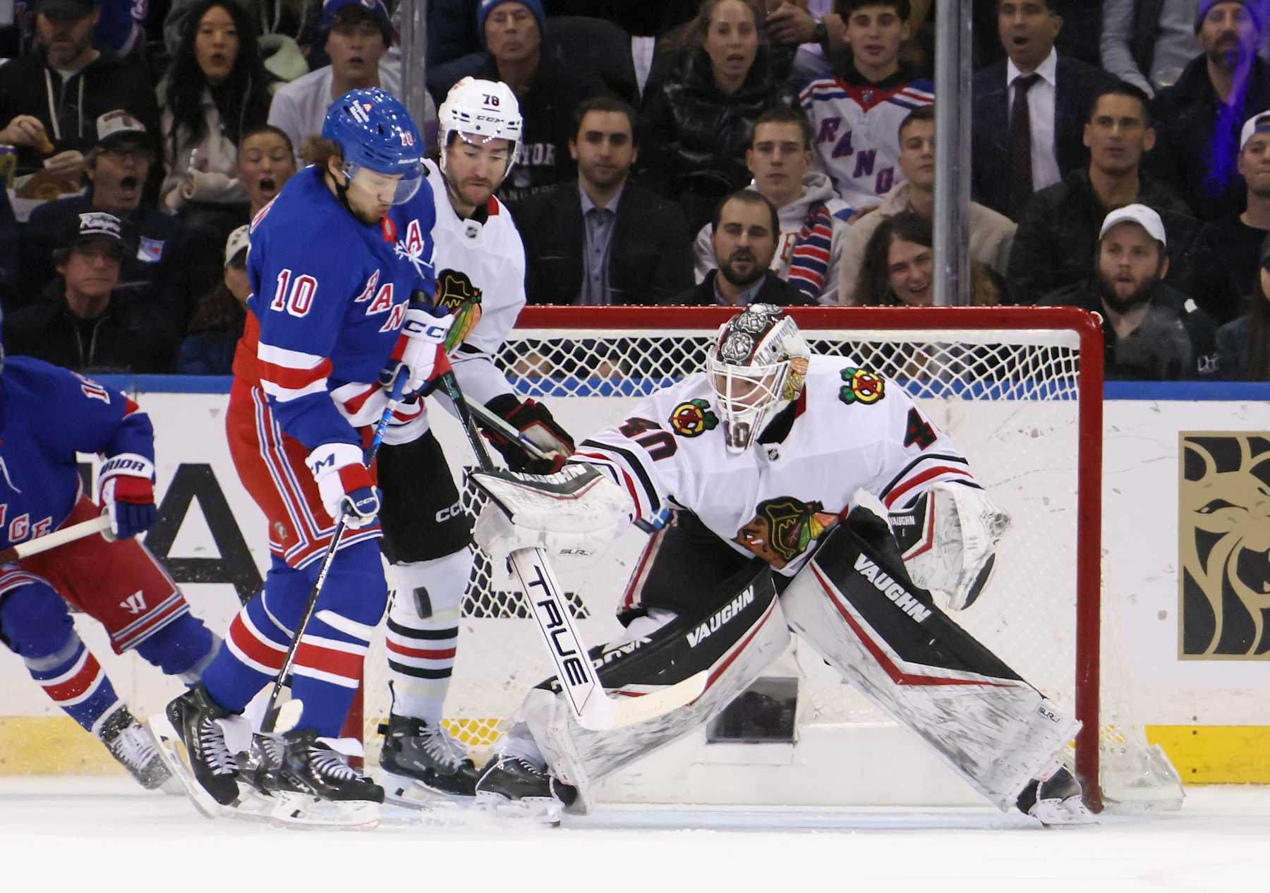 NEW YORK, NEW YORK - DECEMBER 09: Arvid Soderblom #40 of the Chicago Blackhawks makes a first period blocker save as Artemi Panarin #10 of the New York Rangers looks for a rebound at Madison Square Garden on December 09, 2024 in New York City. (Photo by Bruce Bennett/Getty Images)