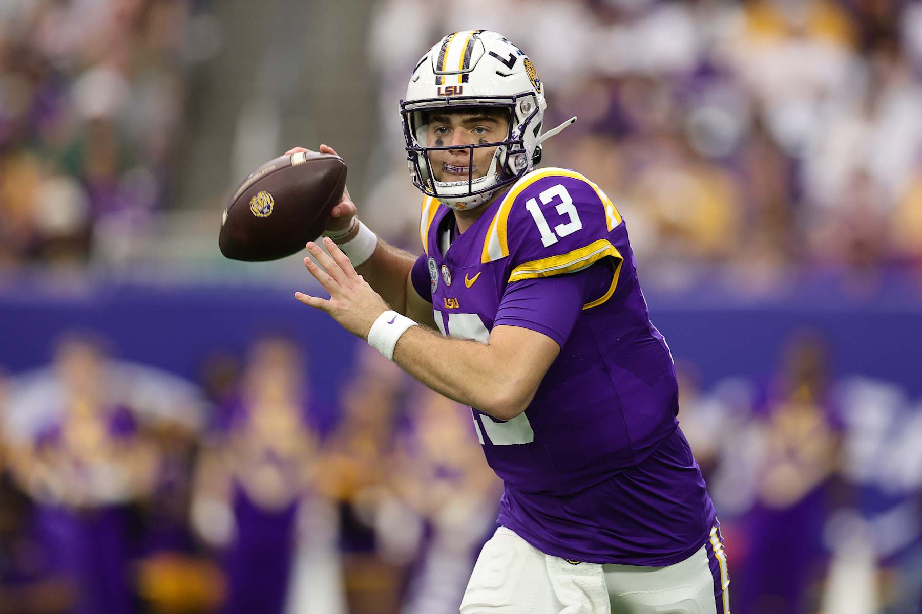HOUSTON, TEXAS - DECEMBER 31: Garrett Nussmeier #13 of the LSU Tigers passes the ball against the Baylor Bears during the first half in the Kinder's Texas Bowl at NRG Stadium on December 31, 2024 in Houston, Texas. (Photo by Alex Slitz/Getty Images)