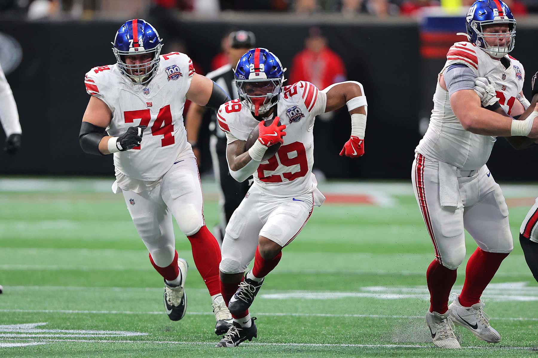 ATLANTA, GA - DECEMBER 22: New York Giants rookie running back Tyrone Tracy, Jr. #29 rushes up the middle during the Sunday afternoon NFL game between the Atlanta Falcons and the New York Giants on Sunday, December 22, 2024 at the Mercedes-Benz Stadium in Atlanta, Georgia. (Photo by David J. Griffin/Icon Sportswire via Getty Images)