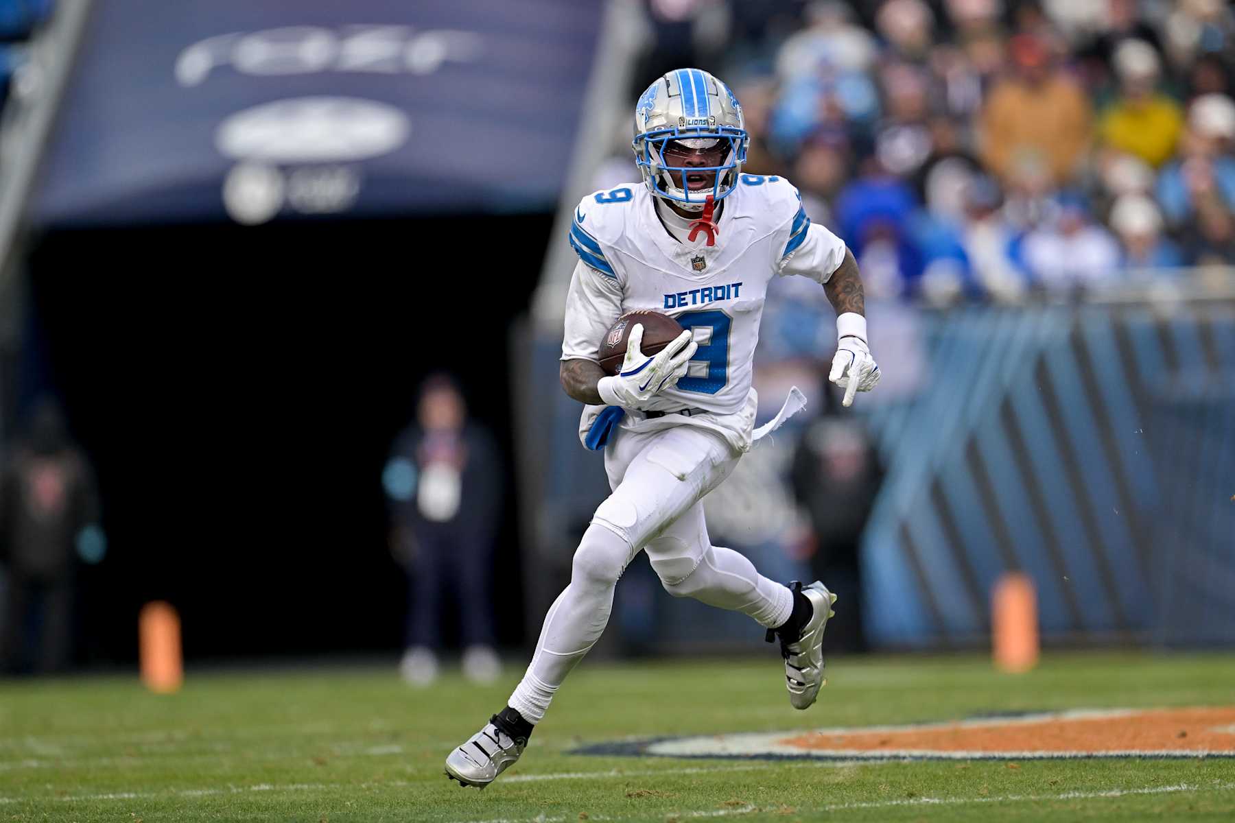 CHICAGO, ILLINOIS - DECEMBER 22: Jameson Williams #9 of the Detroit Lions carries the ball against the Chicago Bears during the third quarter at Soldier Field on December 22, 2024 in Chicago, Illinois. (Photo by Quinn Harris/Getty Images)