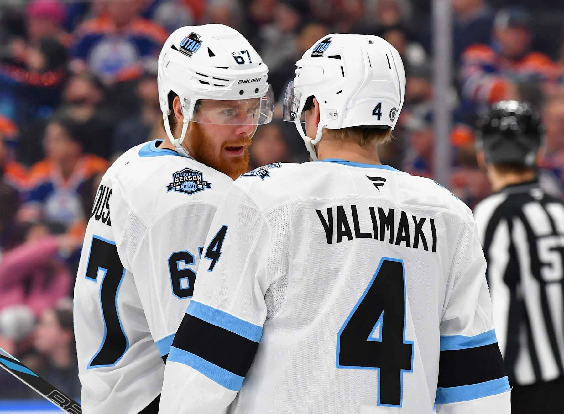 EDMONTON, CANADA - DECEMBER 31: Lawson Crouse #67 and Juuso Valimaki #4 of the Utah Hockey Club have a conversation during a stoppage in play in the third period of the game against the Edmonton Oilers at Rogers Place on December 31, 2024, in Edmonton, Alberta, Canada. (Photo by Andy Devlin/NHLI via Getty Images)