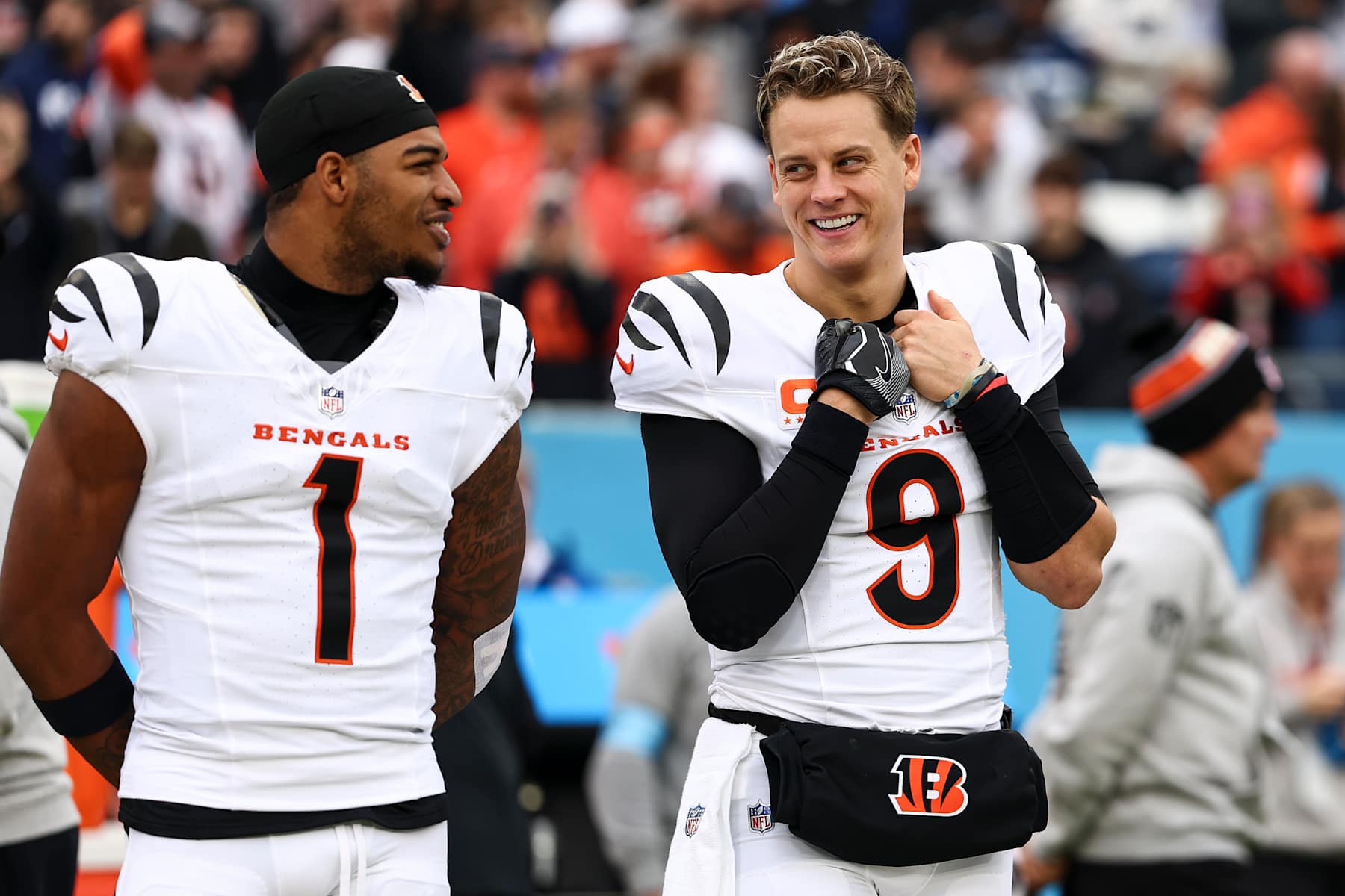 NASHVILLE, TENNESSEE - DECEMBER 15: Joe Burrow #9 of the Cincinnati Bengals smiles with Ja'Marr Chase #1 prior to an NFL football game against the Tennessee Titans at Nissan Stadium on December 15, 2024 in Nashville, Tennessee. (Photo by Kevin Sabitus/Getty Images)