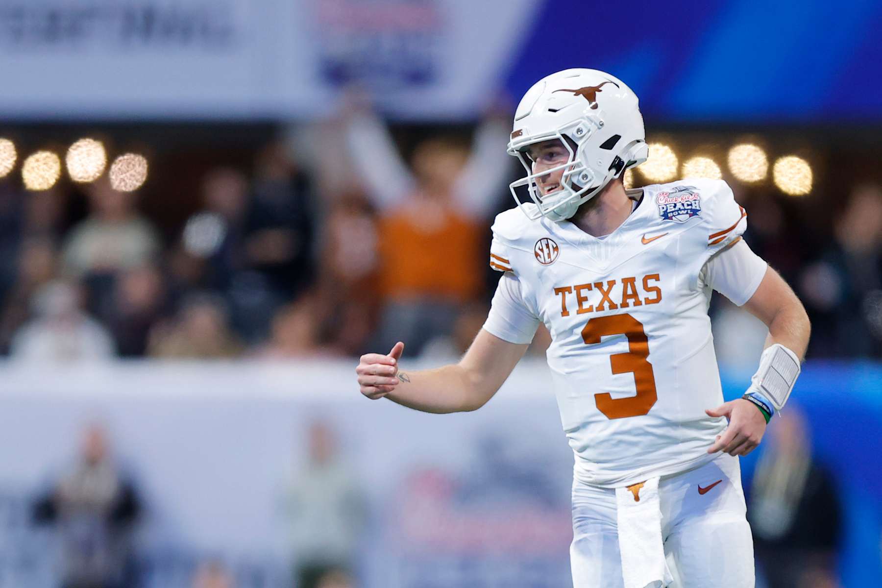 ATLANTA, GEORGIA - JANUARY 01: Quinn Ewers #3 of the Texas Longhorns reacts after a touchdown during the first quarter against the Arizona State Sun Devils in the Chick-fil-A Peach Bowl at Mercedes-Benz Stadium on January 01, 2025 in Atlanta, Georgia.  (Photo by Todd Kirkland/Getty Images)