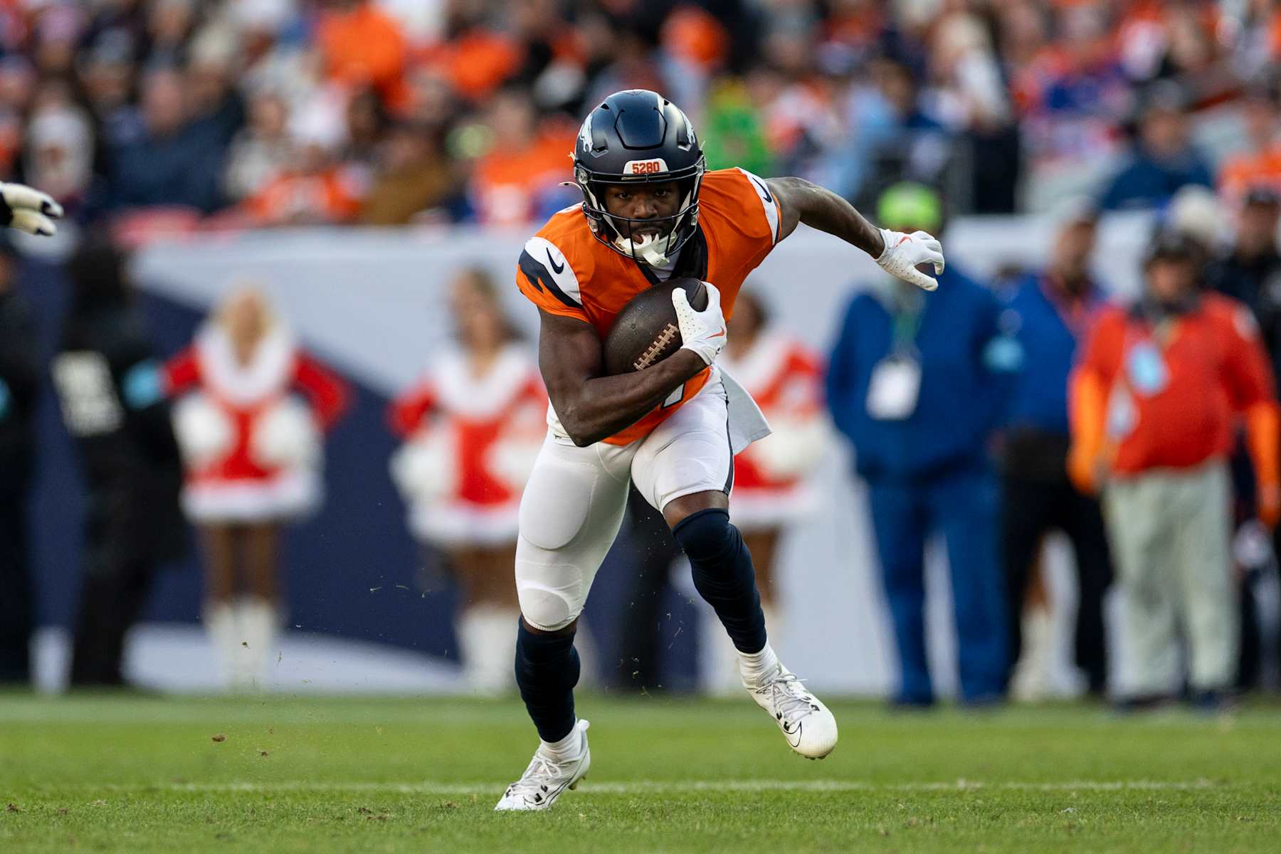DENVER, COLORADO - DECEMBER 15: Marvin Mims Jr. #19 of the Denver Broncos runs with the ball during an NFL Football game against the Indianapolis Colts at Empower Field At Mile High on December 15, 2024 in Denver, Colorado. (Photo by Michael Owens/Getty Images)
