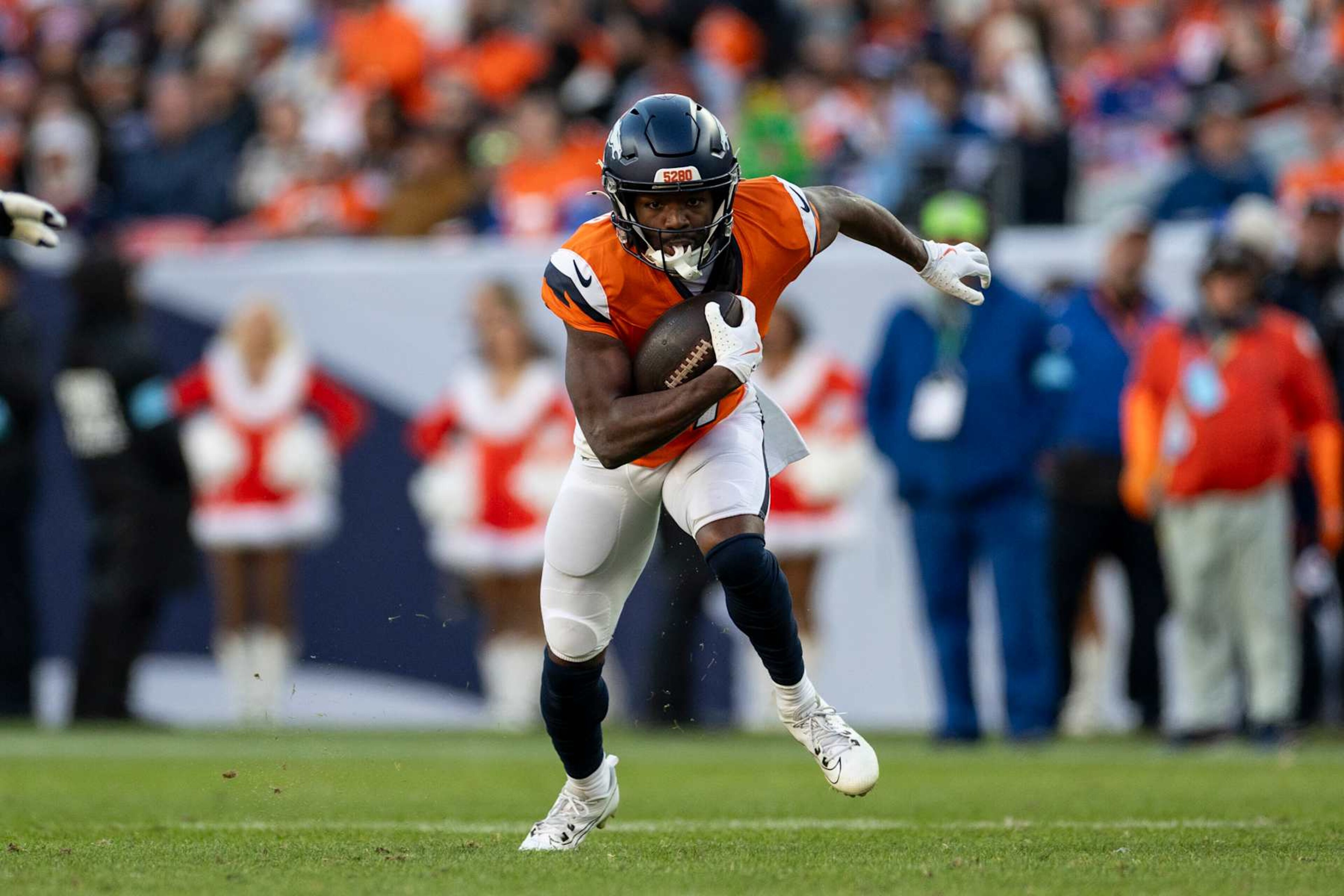 DENVER, COLORADO - DECEMBER 15: Marvin Mims Jr. #19 of the Denver Broncos runs with the ball during an NFL Football game against the Indianapolis Colts at Empower Field At Mile High on December 15, 2024 in Denver, Colorado. (Photo by Michael Owens/Getty Images)