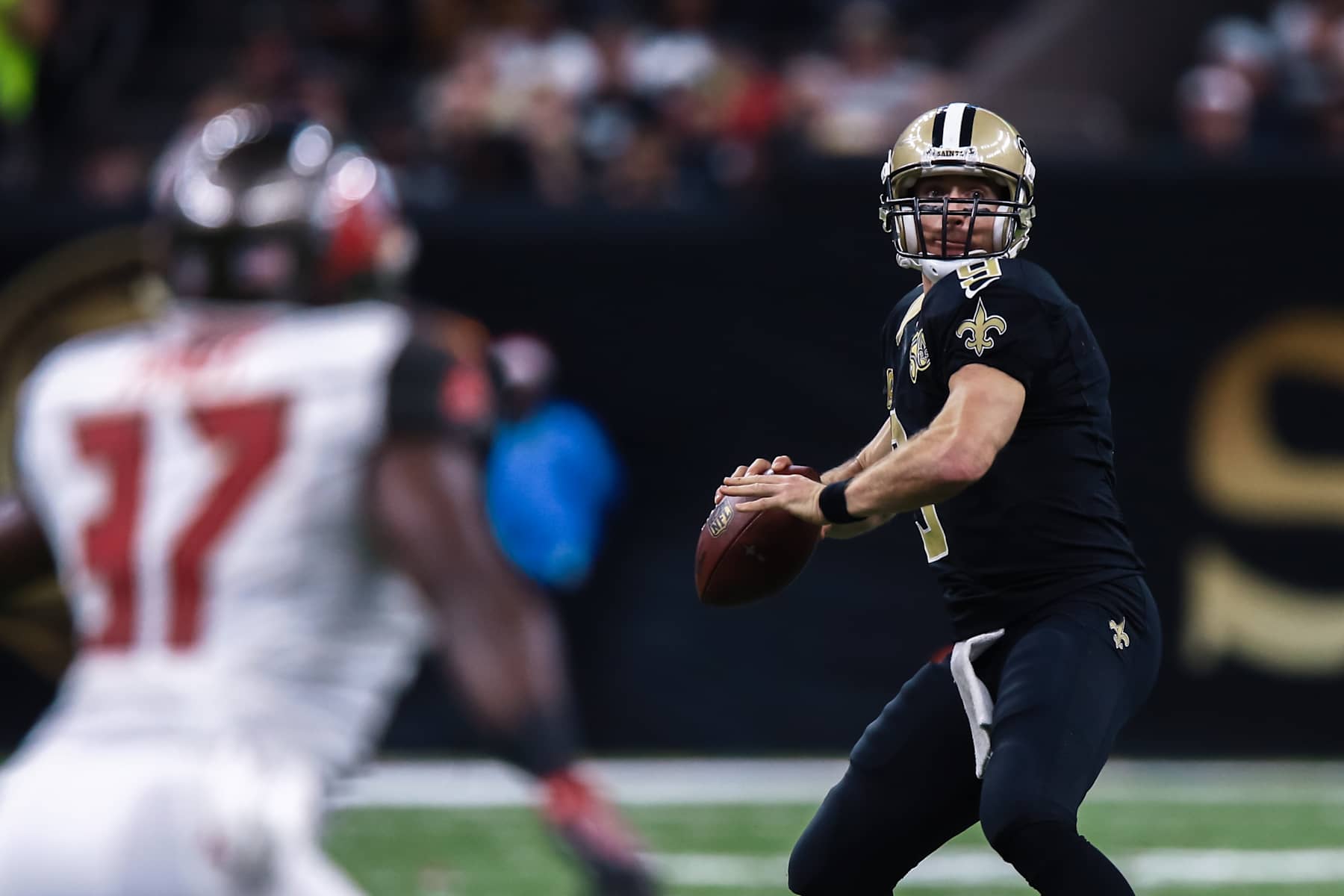 NEW ORLEANS, LA - DECEMBER 24: Tampa Bay Buccaneers strong safety Keith Tandy (37) eyes New Orleans Saints quarterback Drew Brees (9) as he passes downfield during the NFL game between the New Orleans Saints and the Tampa Bay Buccaneers on December 24, 2016 at the Mercedes-Benz Superdome in New Orleans, LA. (Photo by Stephen Lew/Icon Sportswire via Getty Images)